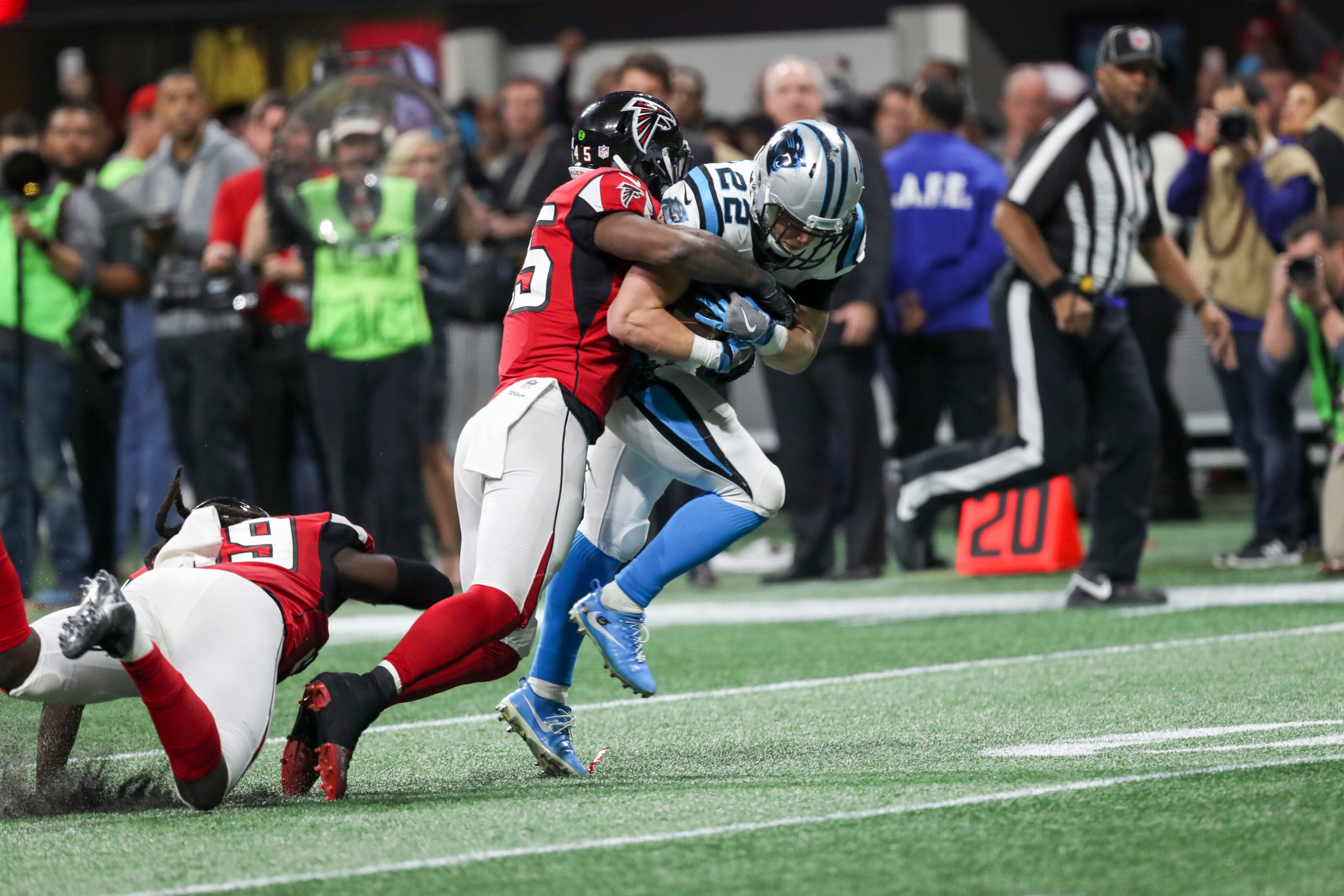 12/31/2017 -- Atlanta, GA, - Carolina Panthers running back Christian McCaffrey (22) is tackled by Atlanta Falcons middle linebacker Deion Jones (45) during the second half of the game at Mercedes Benz Stadium, Sunday, December 31, 2017. The Atlanta Falcons beat the Carolina Panthers, 22-10. ALYSSA POINTER/ALYSSA.POINTER@AJC.COM