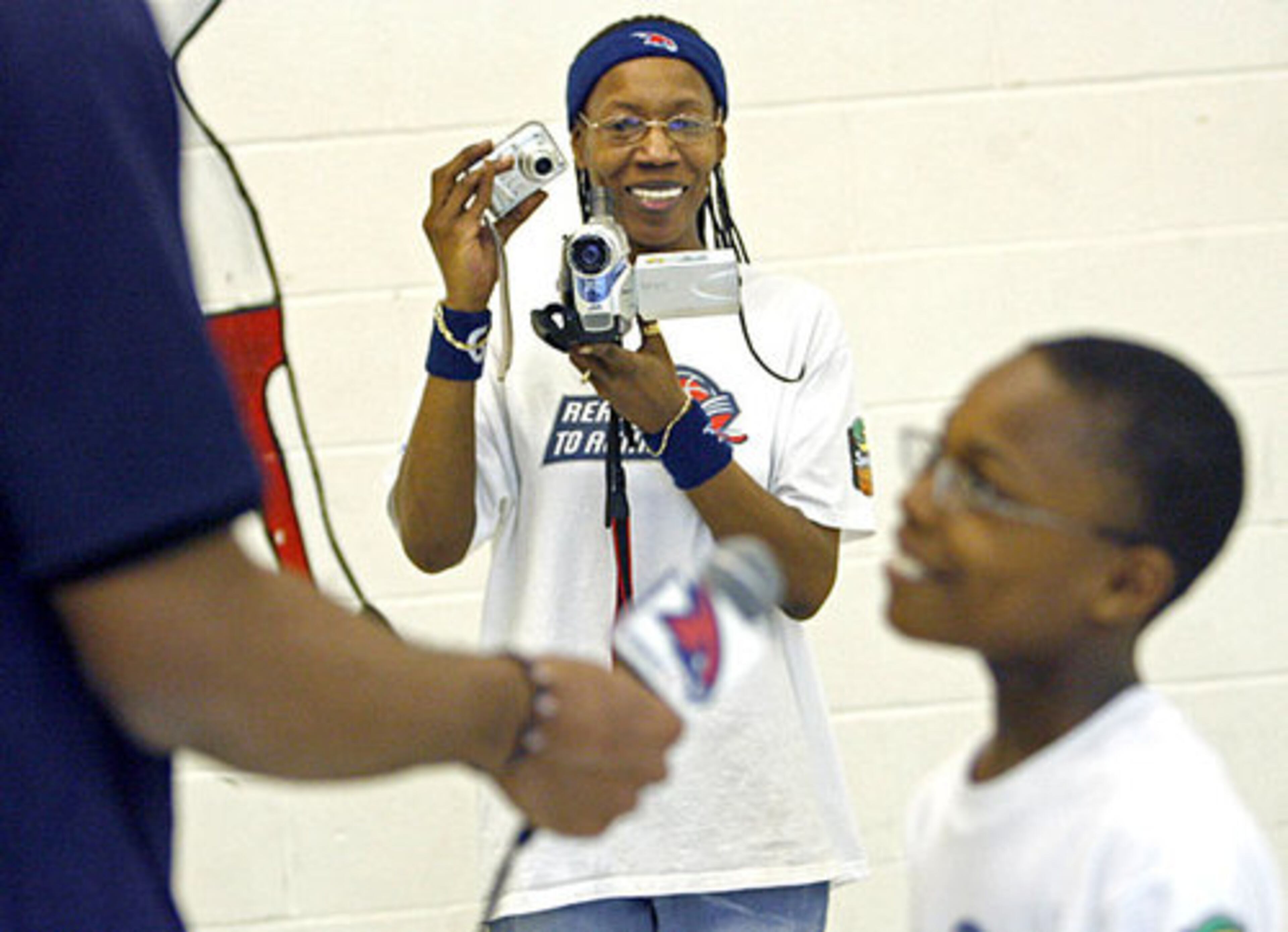 Deantae's mother, Diane Birdsong, takes pictures and video of her son's big day.