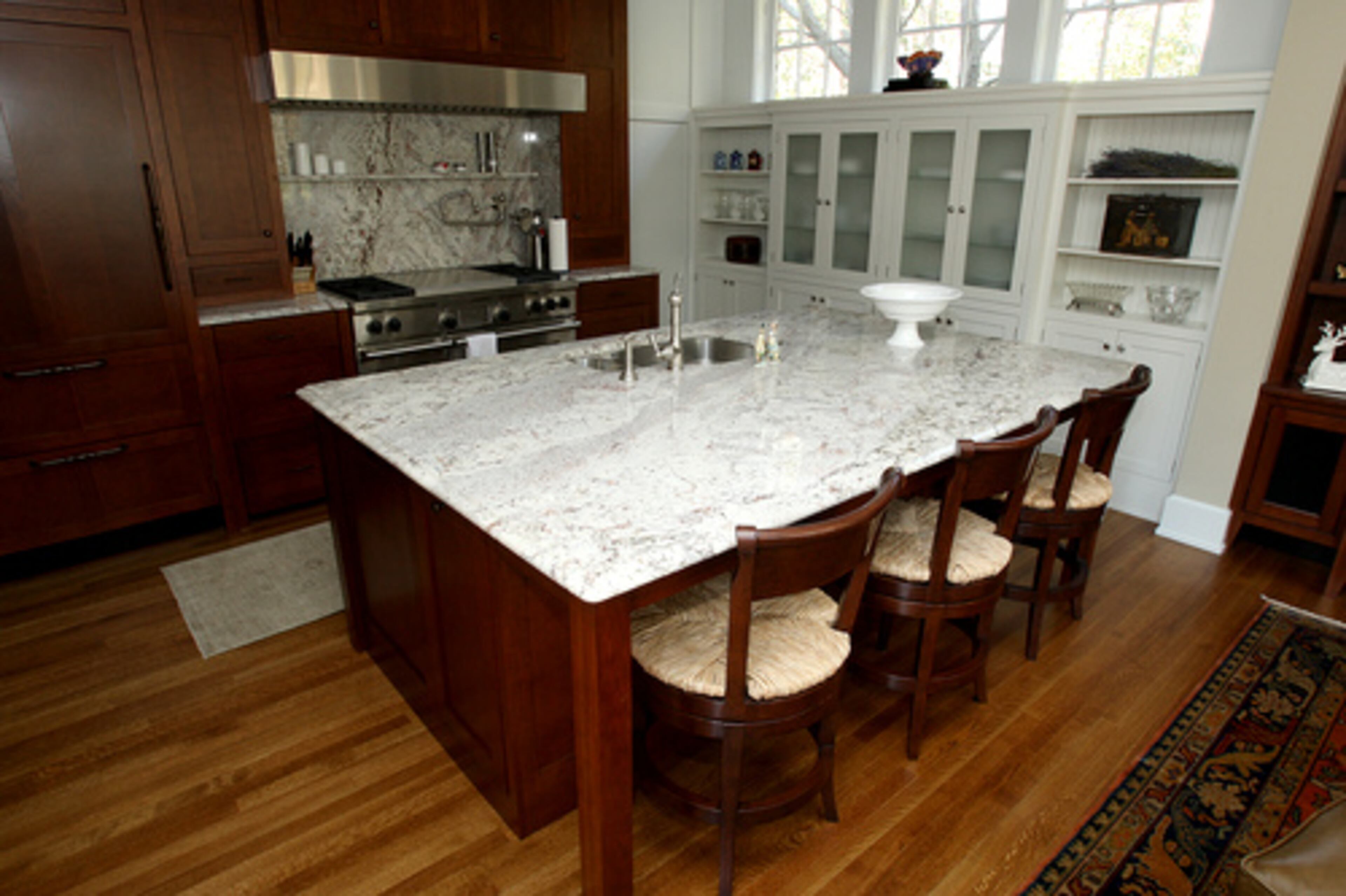The kitchen was the most recent renovation. "The rest of the remodeling was easy compared to the kitchen," says Cox. The contractor had North Georgia white oak milled to the exact specifications of the kitchen's original flooring.