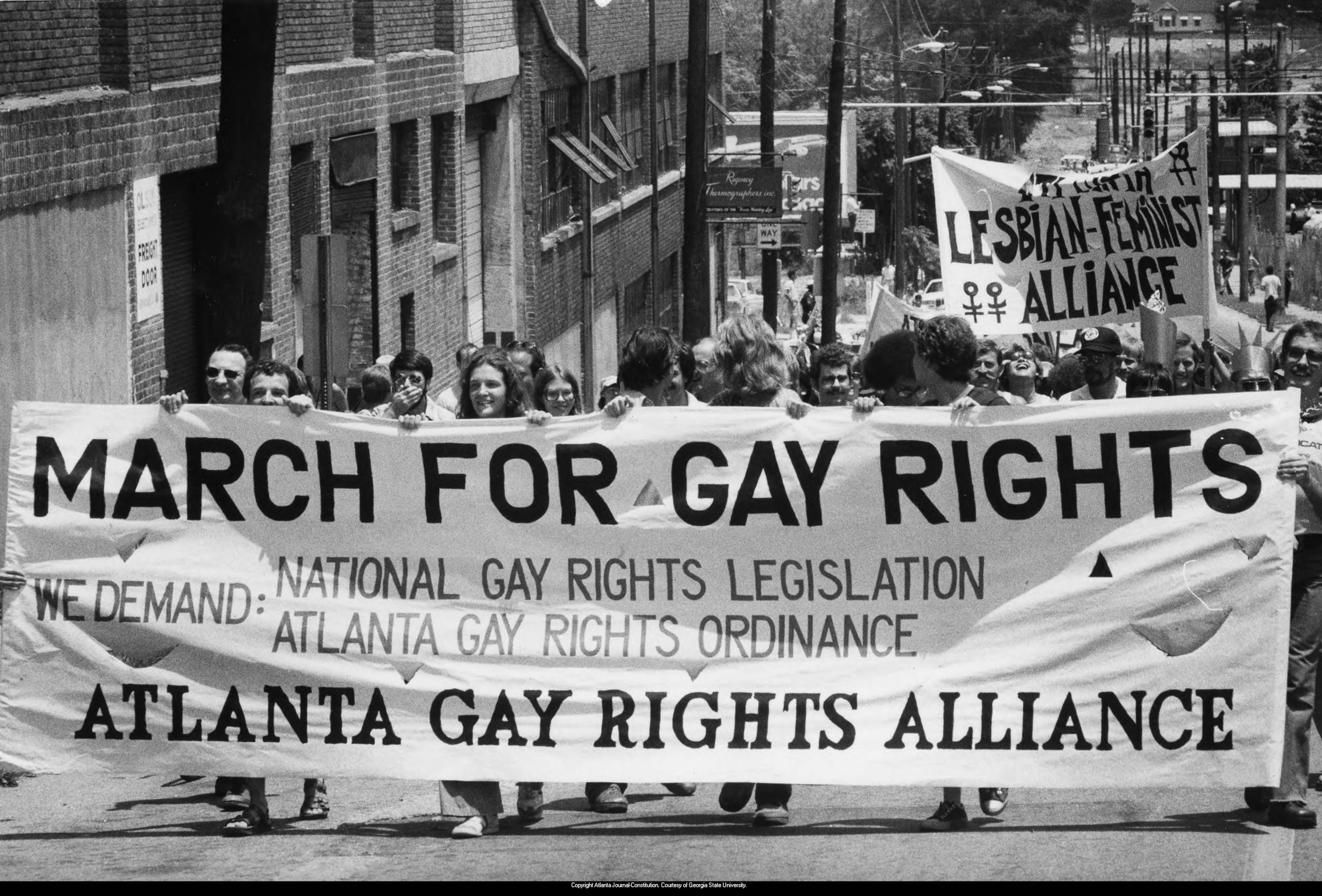 Gay men and women demonstrate with the Atlanta Gay Rights Alliance for gay rights legislation in Atlanta in the summer of 1977. PHOTO BY JEROME MCCLENDON / AJC ARCHIVES