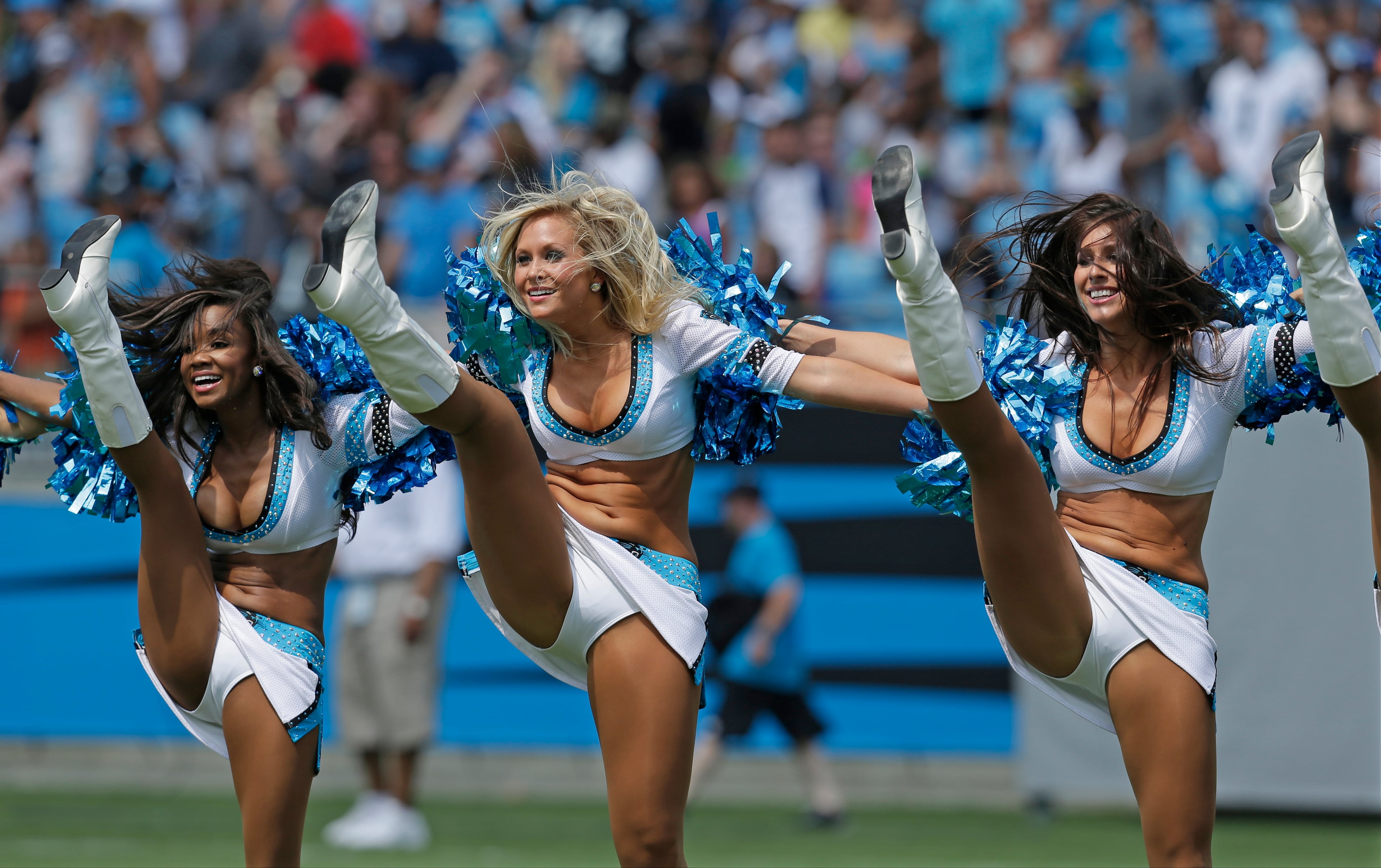 Carolina Panthers cheerleaders perform during an NFL football training camp practice as part of the team's Fan Fest in Charlotte, N.C., Saturday, Aug. 3, 2013.