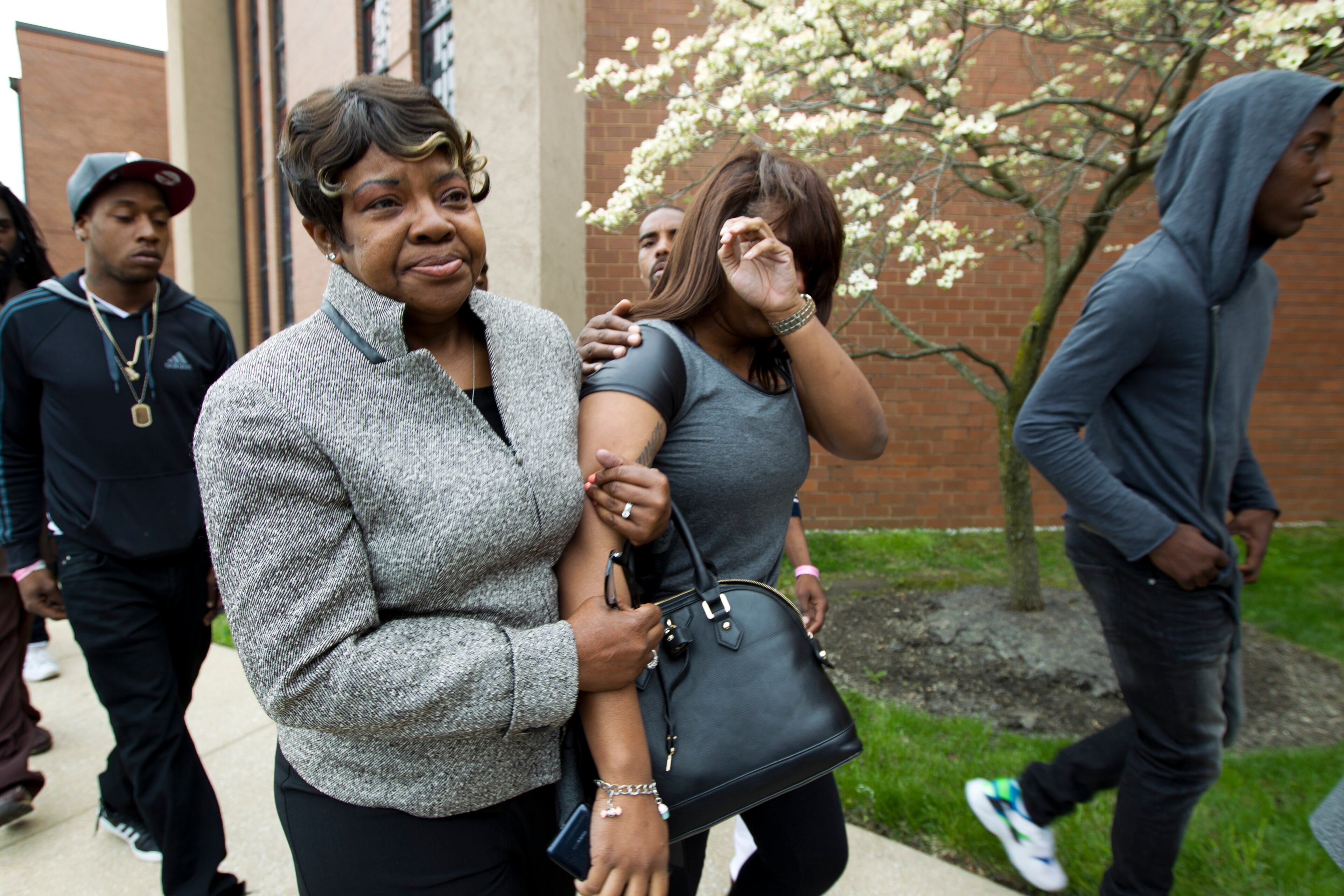 Mourner arrive at Freddie Gray's funeral on Monday, April 27, 2015, at New Shiloh Baptist Church in Baltimore. Gray died from spinal injuries about a week after he was arrested and transported in a Baltimore Police Department van. (AP Photo/Jose Luis Magana)