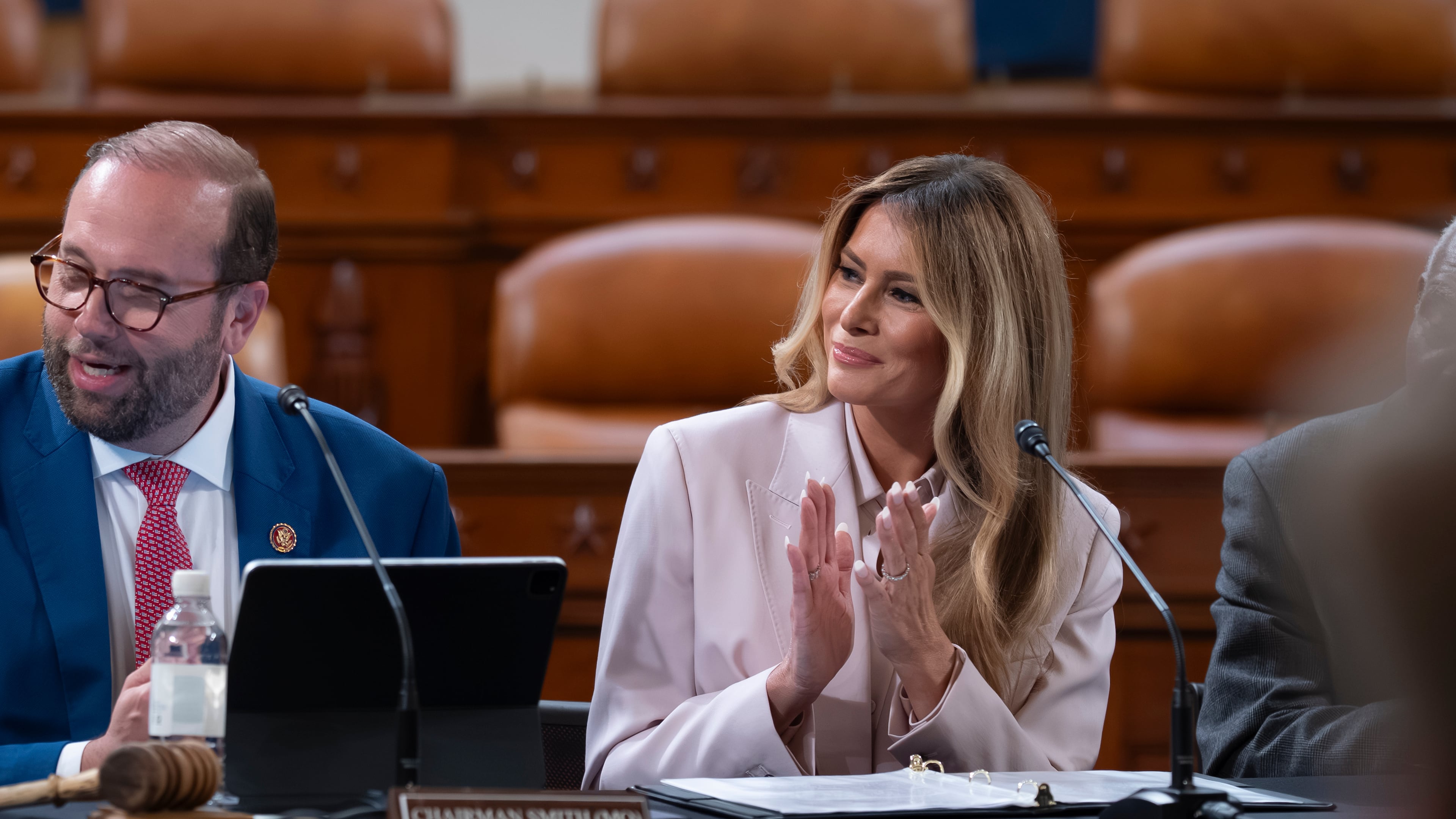 First lady Melania Trump, joined by Rep. Jason Smith, R-Mo., chair of the House Ways and Means Committee, left, speaks to advance her legislative initiative on protecting America's foster care children, at a committee roundtable, at the Capitol in Washington, Wednesday, April 15, 2026. (AP Photo/J. Scott Applewhite)