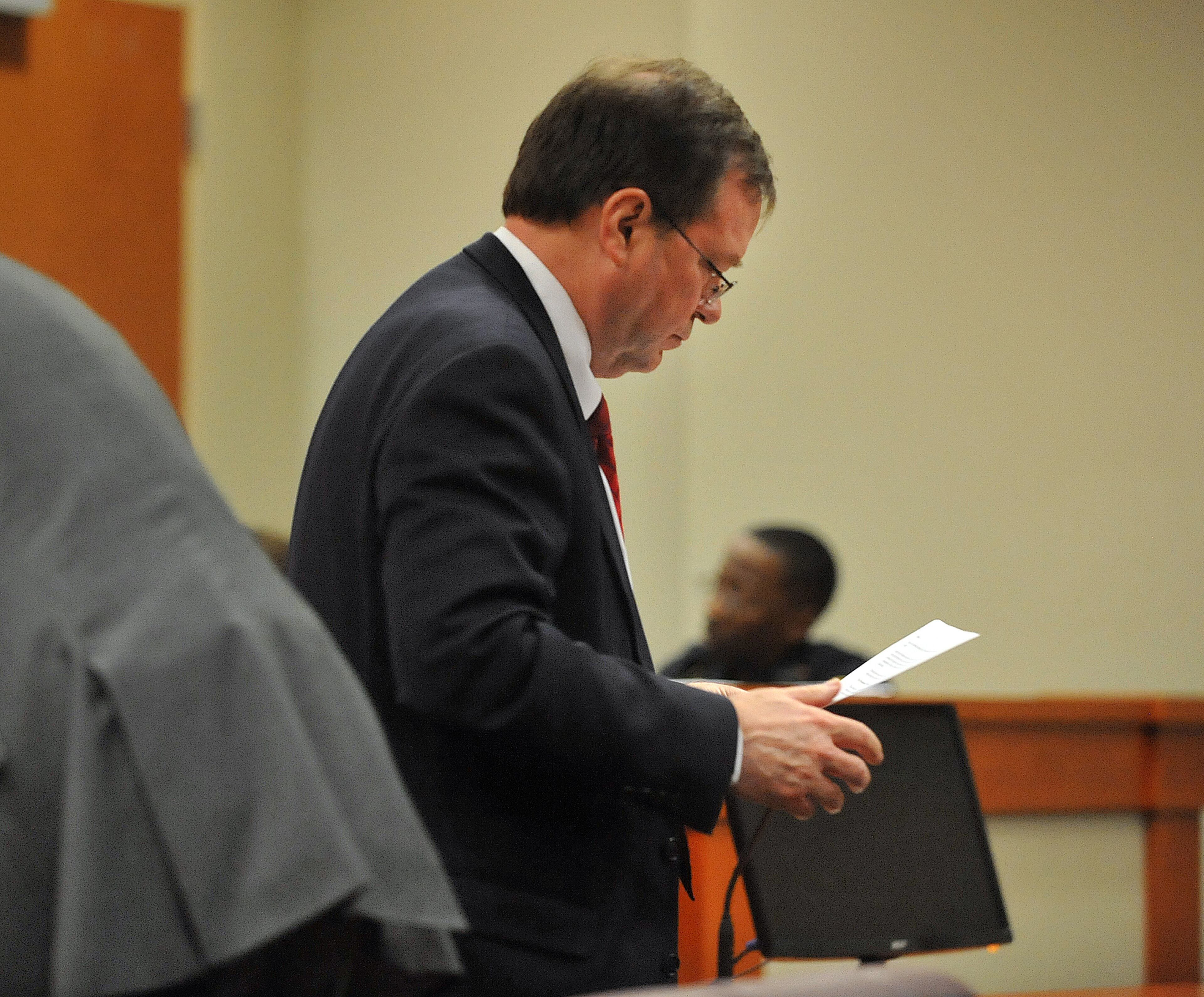UPDATE: On July 1, Burrell Ellis was found guilty on three counts of perjury and one count of attempt to extort out of nine total counts against him. June 30 -- Defense attorney Craig Gillen reads a response to a jury question as deliberations continue for a fifth day in the retrial of embattled DeKalb CEO Burrell Ellis before Superior Court Judge Courtney Johnson Monday, June 30, 2015.