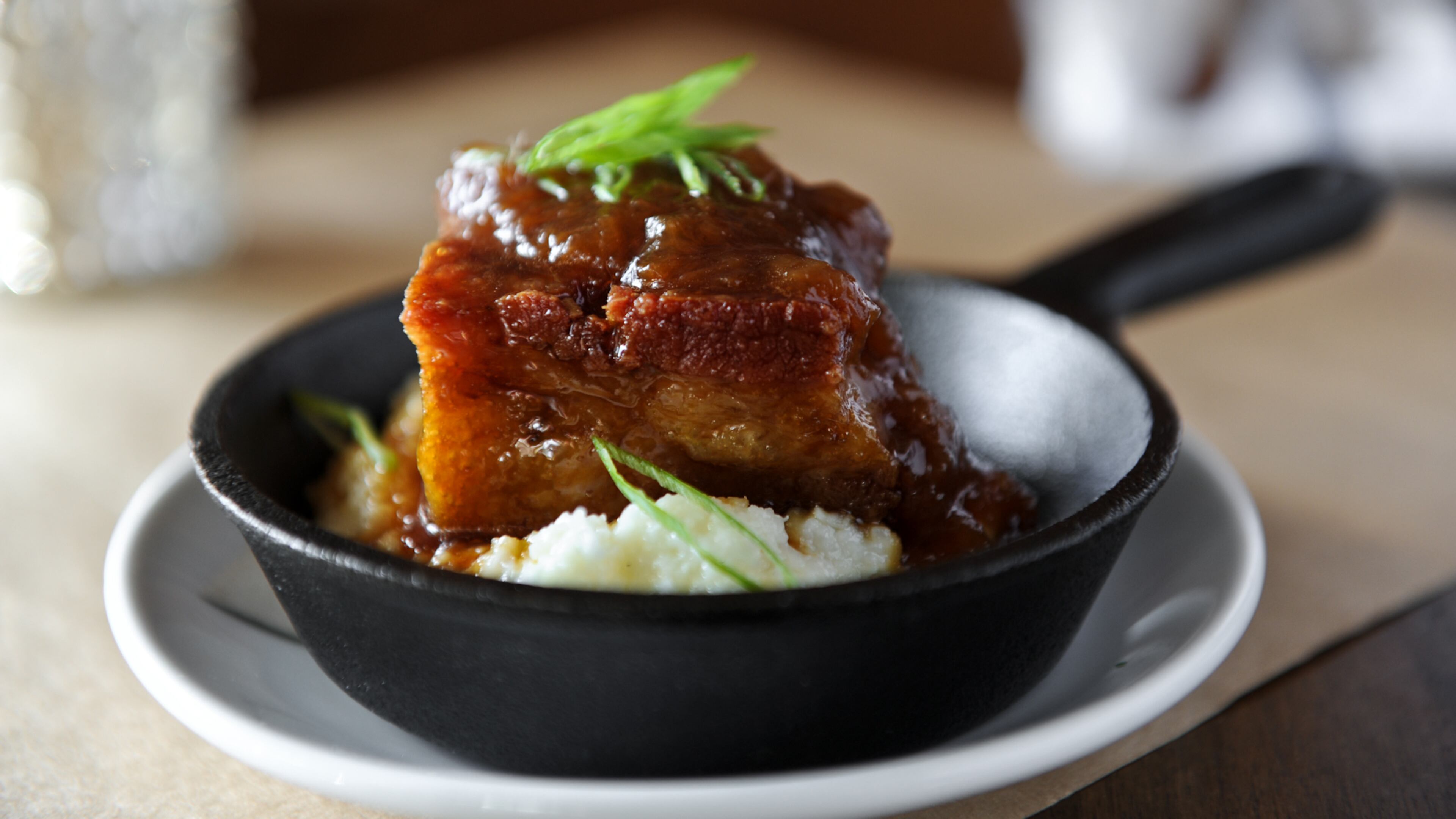 130928-MARIETTA-GA- Jenny Turknetts review of The Butcher, The Baker on the square in Marietta on Saturday September 28, 2013. FOOD: pork belly, peach bourbon jam, cheddar grits. BECKY STEIN)