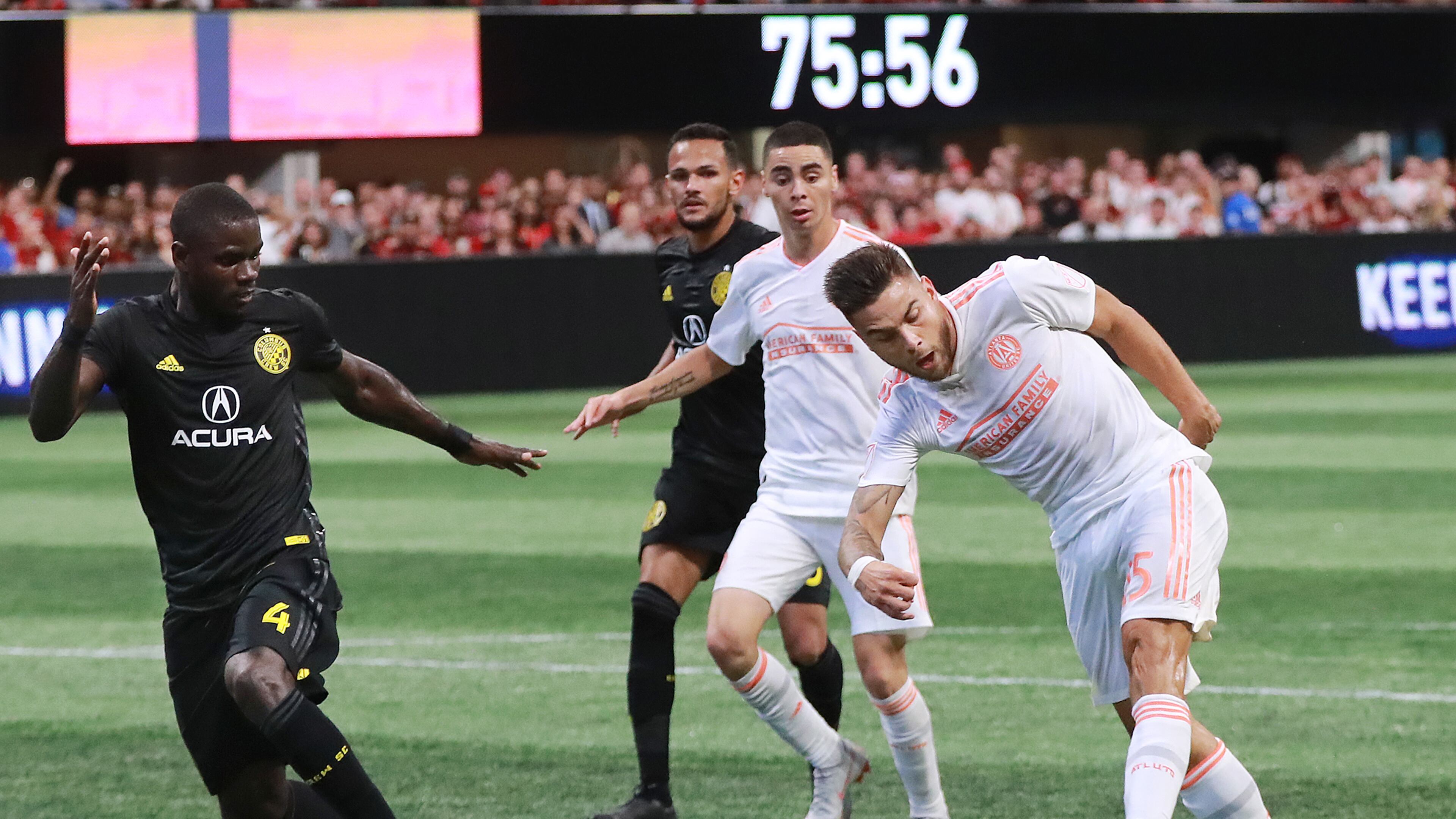 Atlanta United midfielder Hector Villalba scores a goal past Columbus Crew defender Jonathan Mensah for a 2-1 lead during the second half in a MLS soccer match on Sunday, August 19, 2018, in Atlanta. Curtis Compton/ccompton@ajc.com