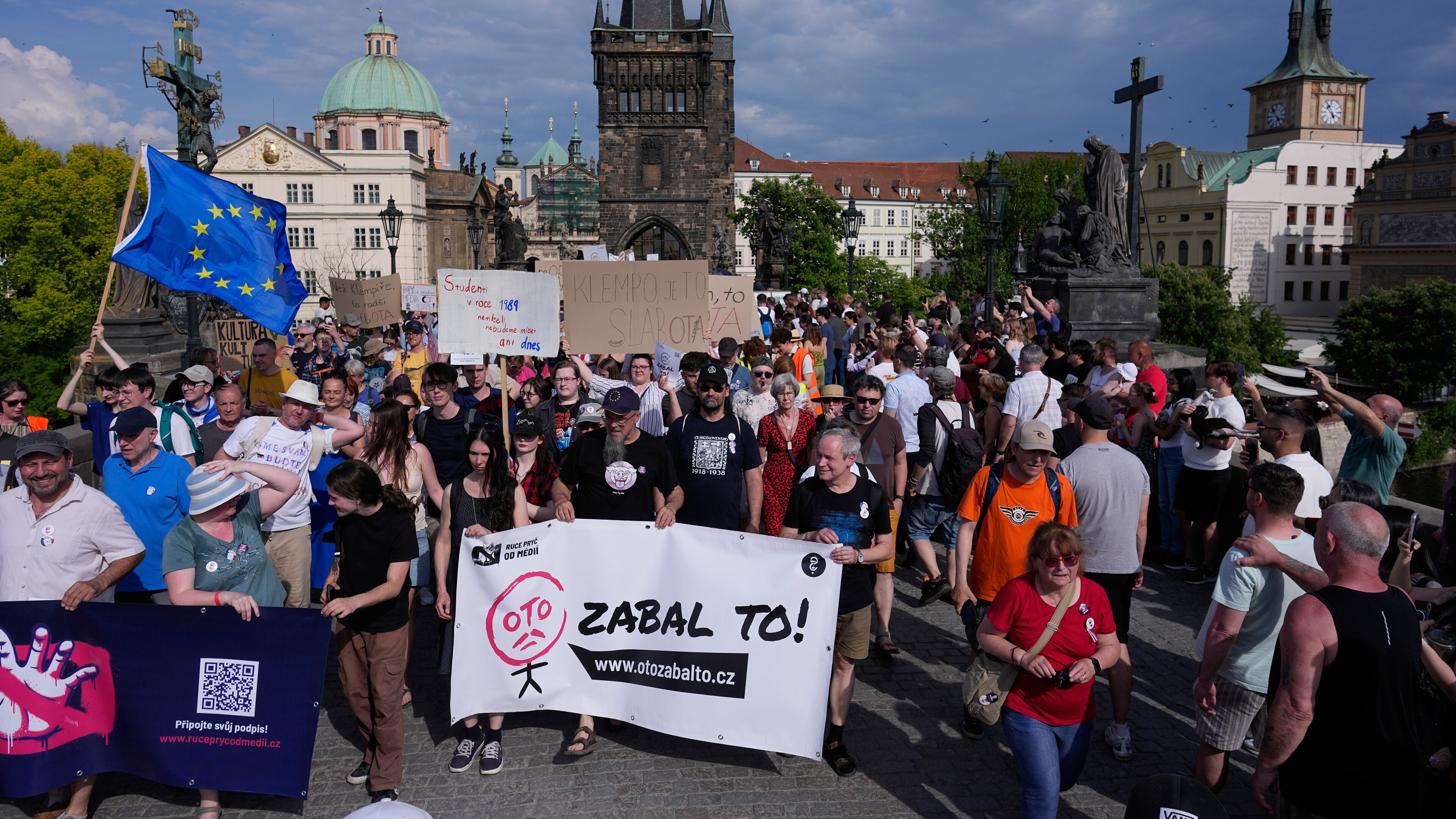 Thousands of people march to protest against a government plan to change public broadcaster funding in Prague, Czech Republic, Sunday, May 24, 2026. (AP Photo/Petr David Josek)