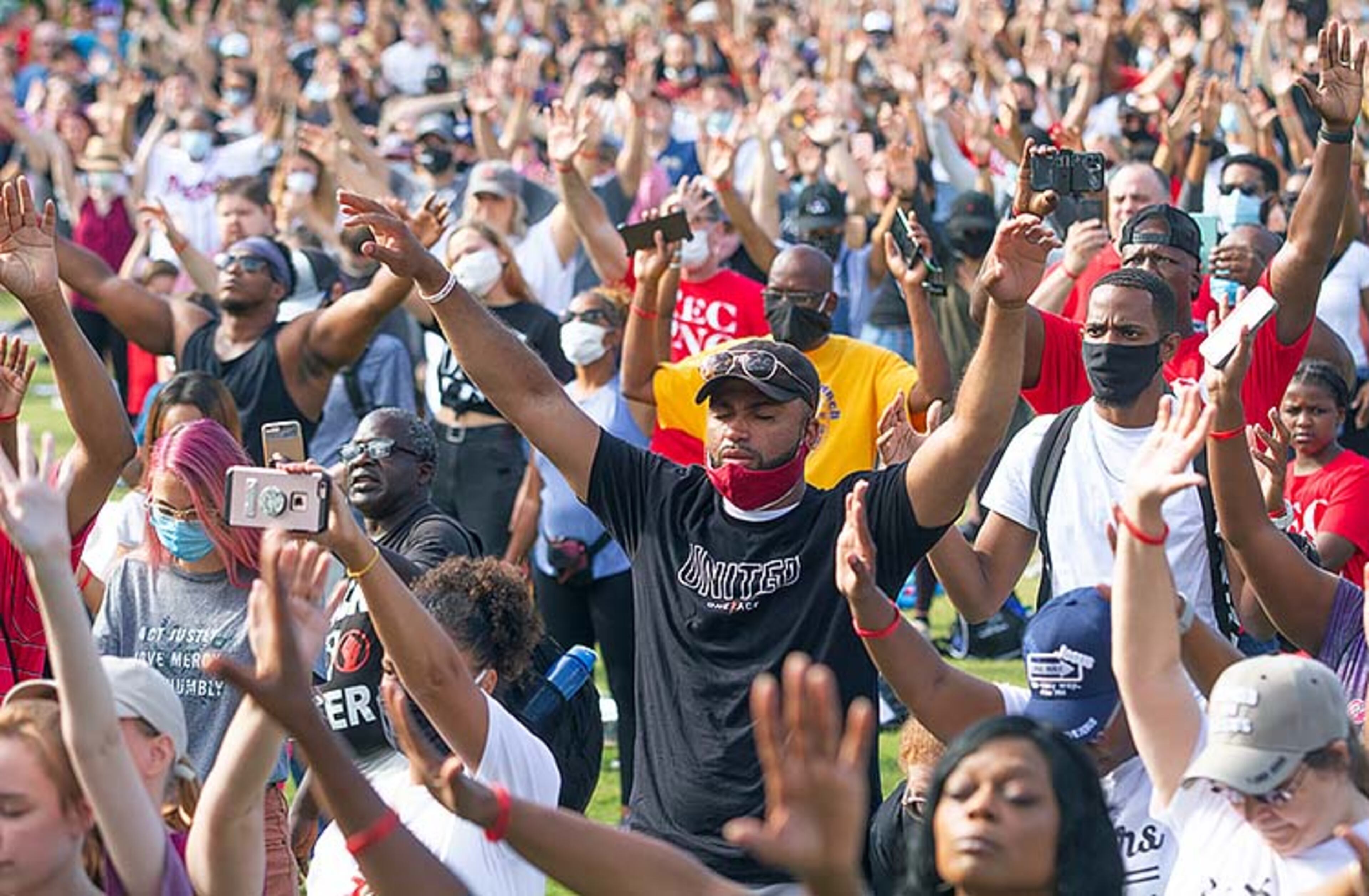 A large crowd gathers at the Centennial Olympic Park stage for an OneRace prayer and worship before marching to the State capital Friday, June 19, 2020. STEVE SCHAEFER FOR THE ATLANTA JOURNAL-CONSTITUTION