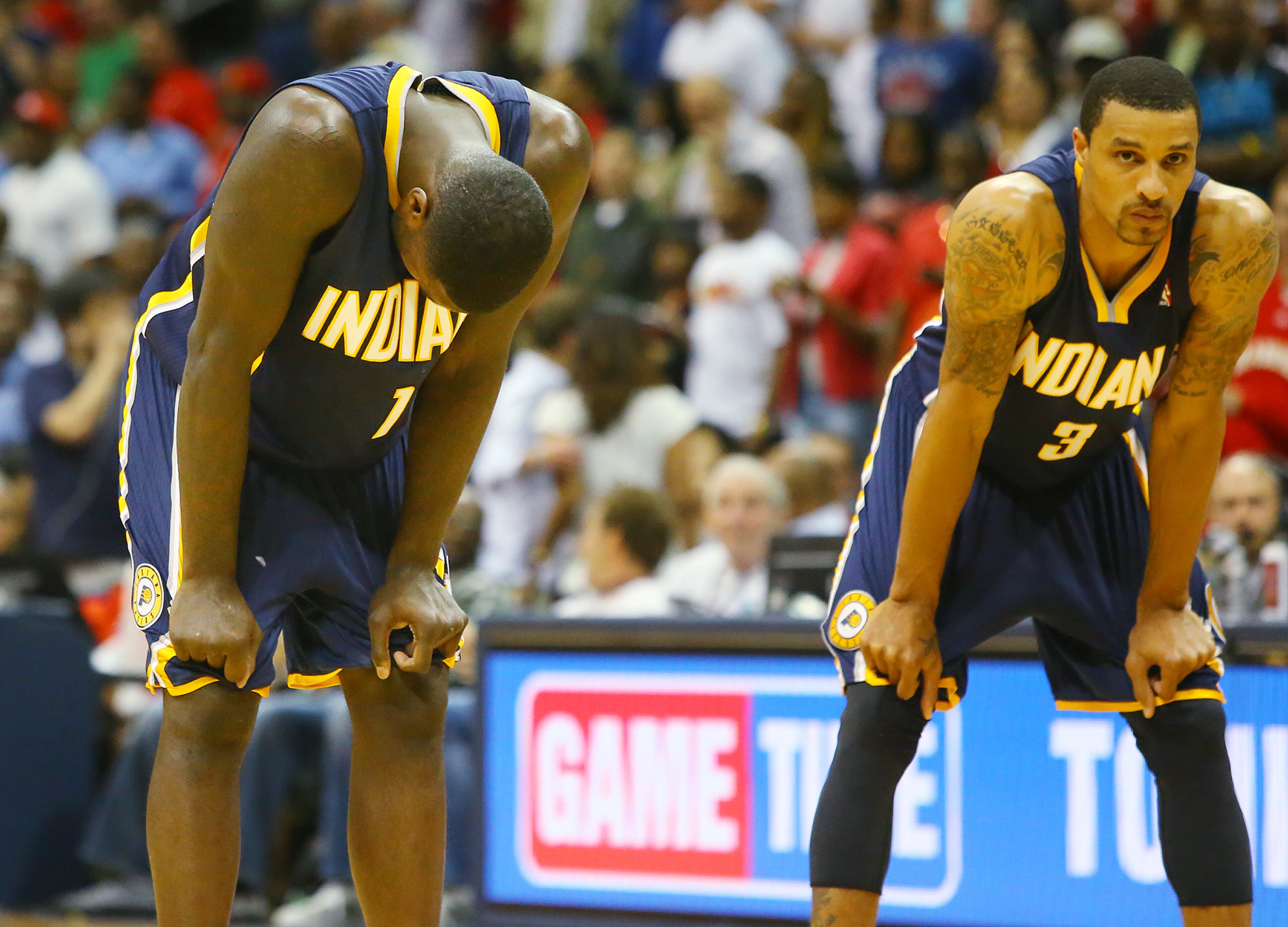 Pacers Lance Stephenson (left) and George Hill react in the final minute of a 98-85 loss to the Hawks during the second half of their NBA playoff game on Thursday, April 24, 2014, in Atlanta. CURTIS COMPTON / CCOMPTON@AJC.COM