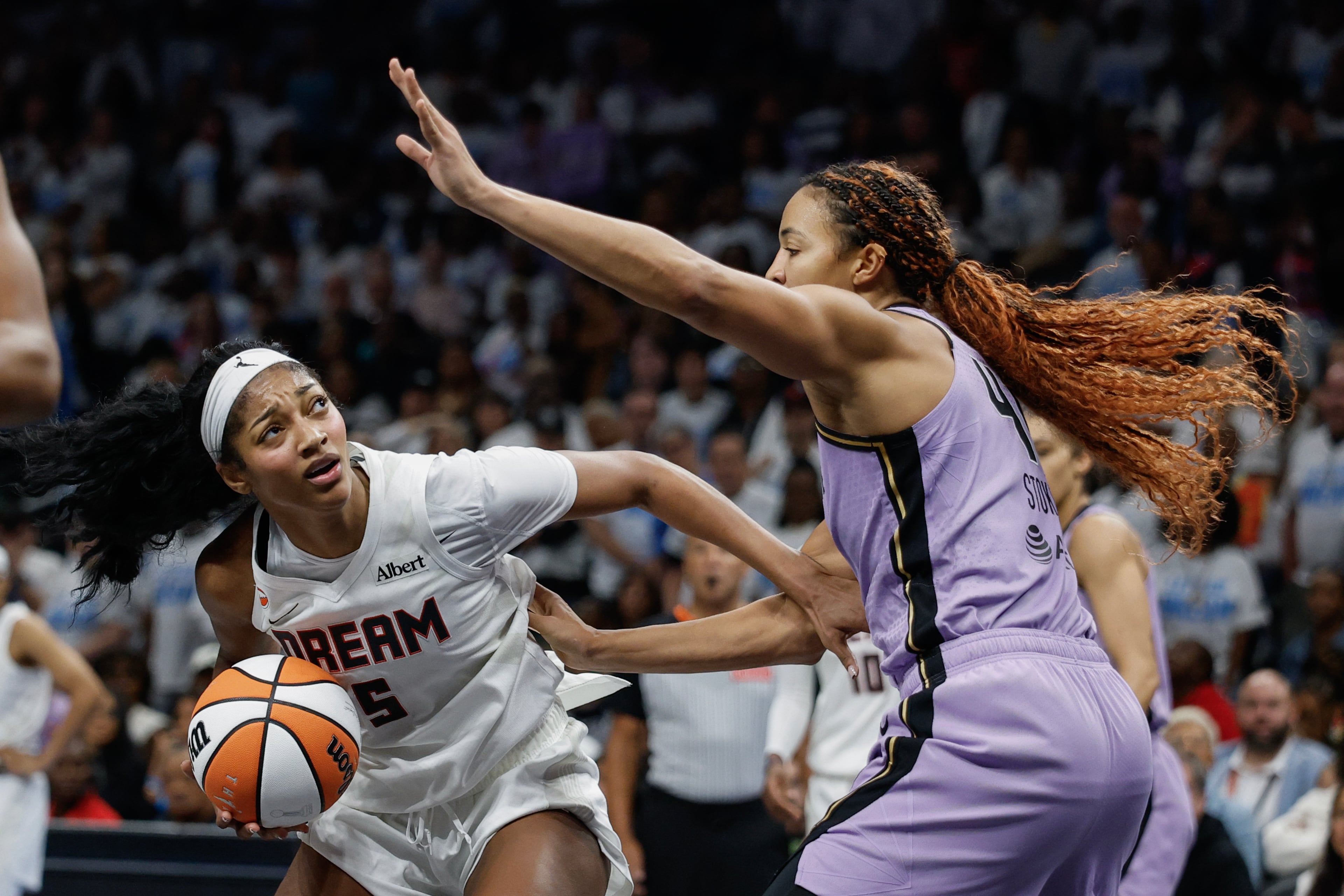 Atlanta Dream forward Angel Reese (left) is defended by Golden State Valkyries center Kiah Stokes during the second half of Game 4 of the WNBA Finals between the Atlanta Dream and the Golden State Valkyries, Saturday, Oct. 24, 2026, in Atlanta. (Erik S. Lesser for the AJC)