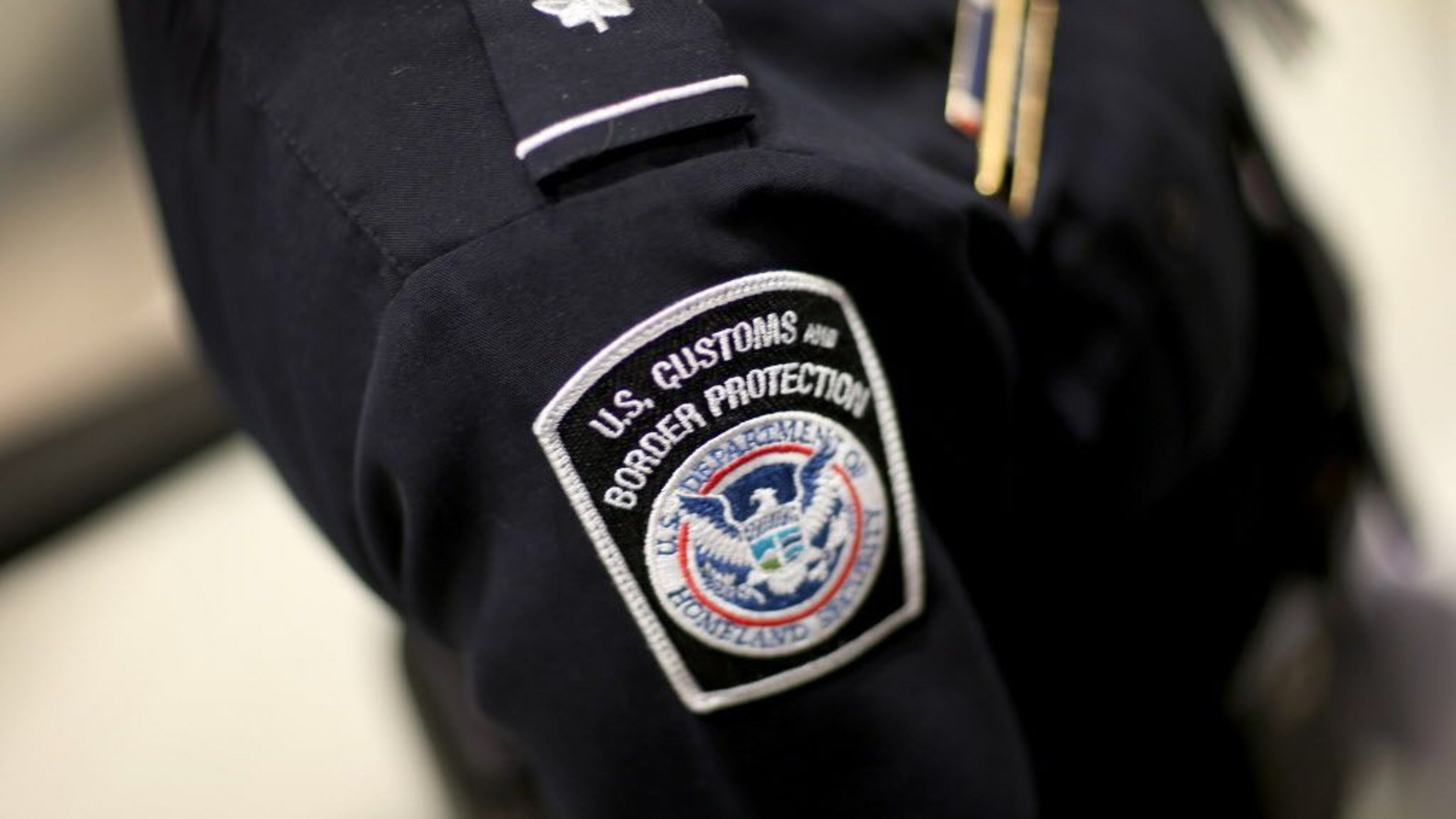 U.S. Customs and Border Protection officer's patch is seen March 4, 2015, as they unveil a new mobile app for international travelers arriving at Miami International Airport.