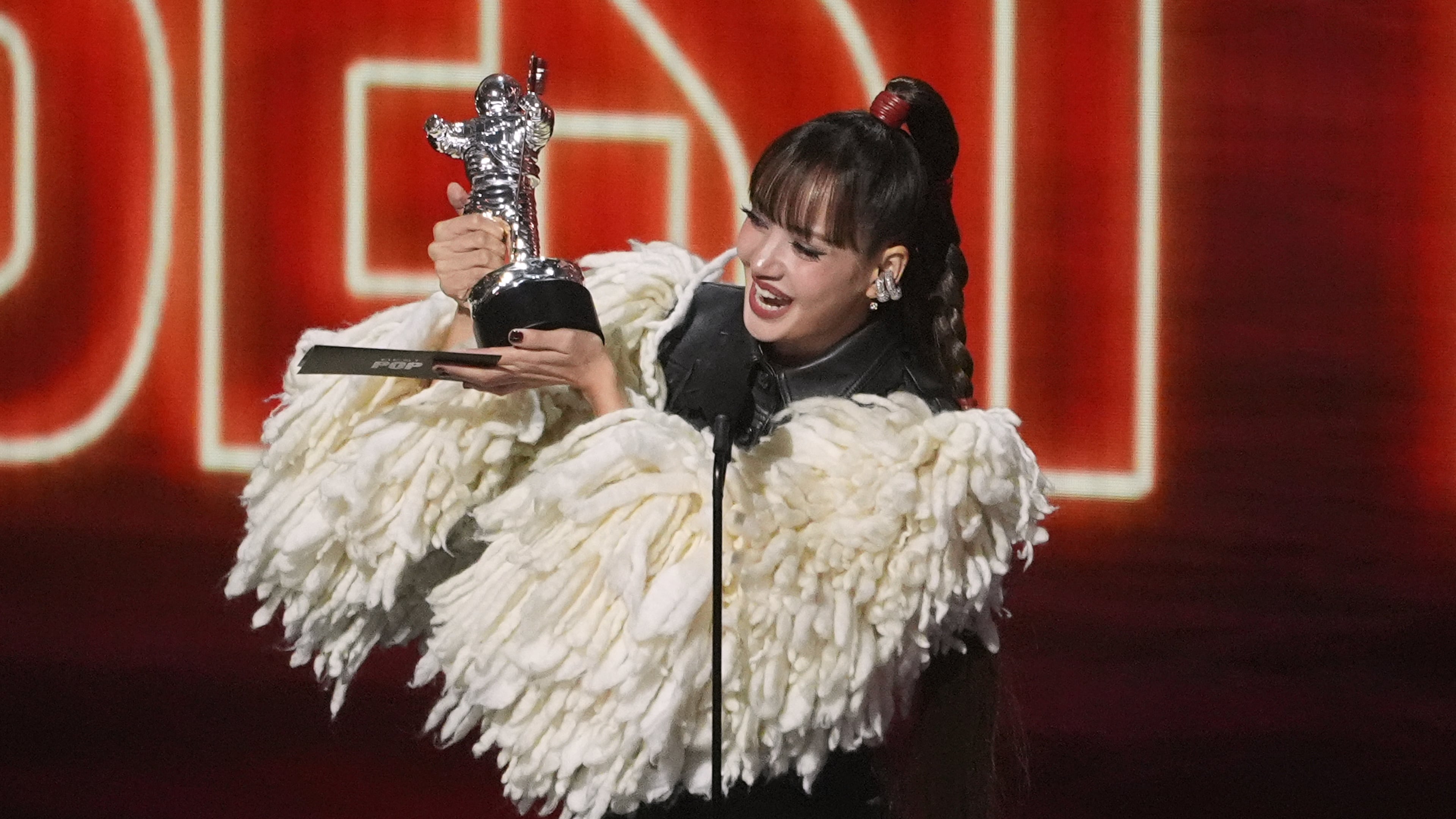 Lisa accepts the award for best pop for "Dream feat. Kentara Sakaguchi" during the MTV Video Music Awards on Sunday, Sept. 27, 2026, at the Peacock Theater in Los Angeles. (AP Photo/Chris Pizzello)
