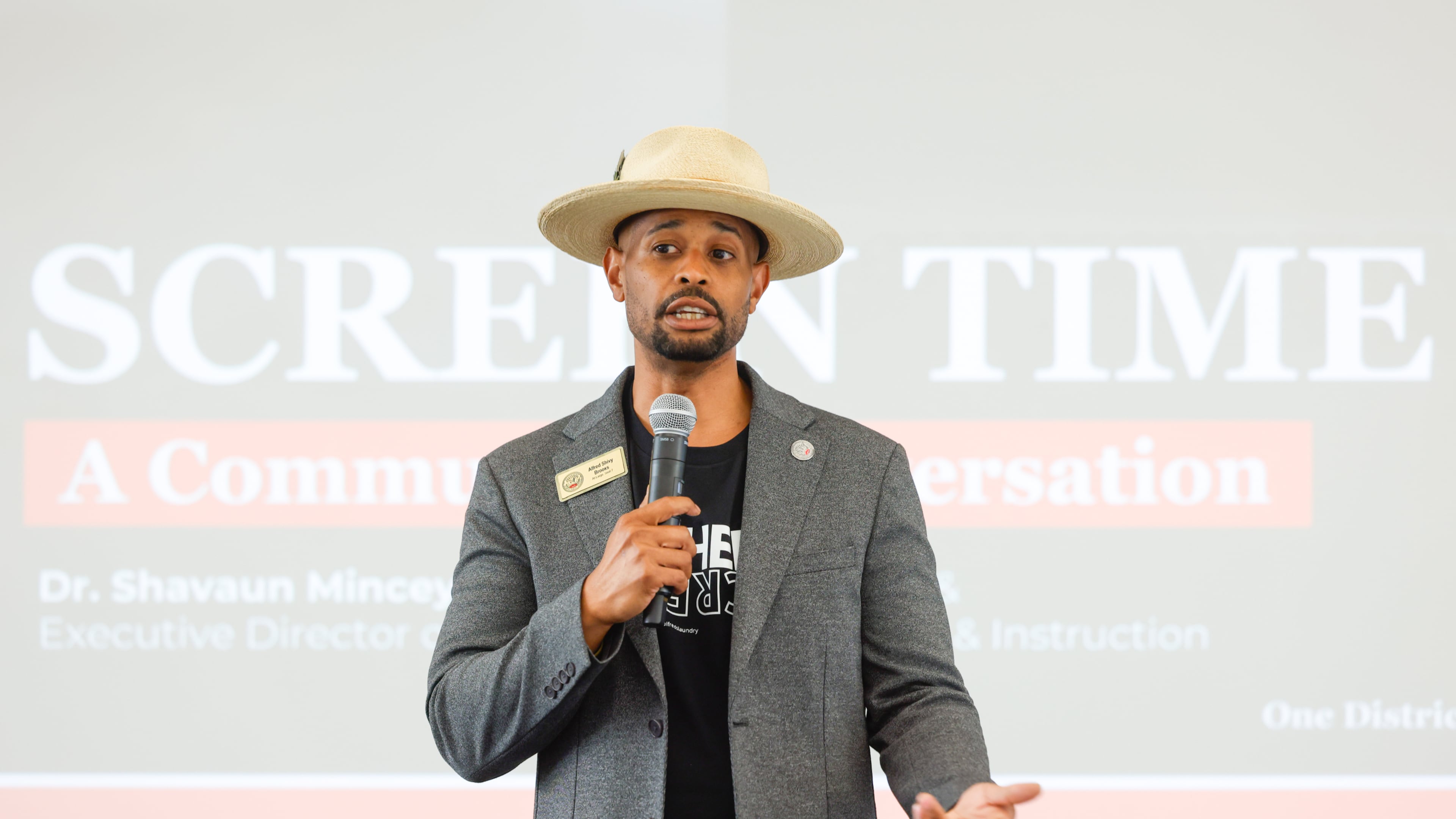 Alfred “Shivy” Brooks addresses a June town hall on the new policy. Brooks is a teacher in Clayton County and chairs the school board's policy review committee, which approved a pilot program on Thursday that limits classroom screen time. (Arvin Temkar/AJC)