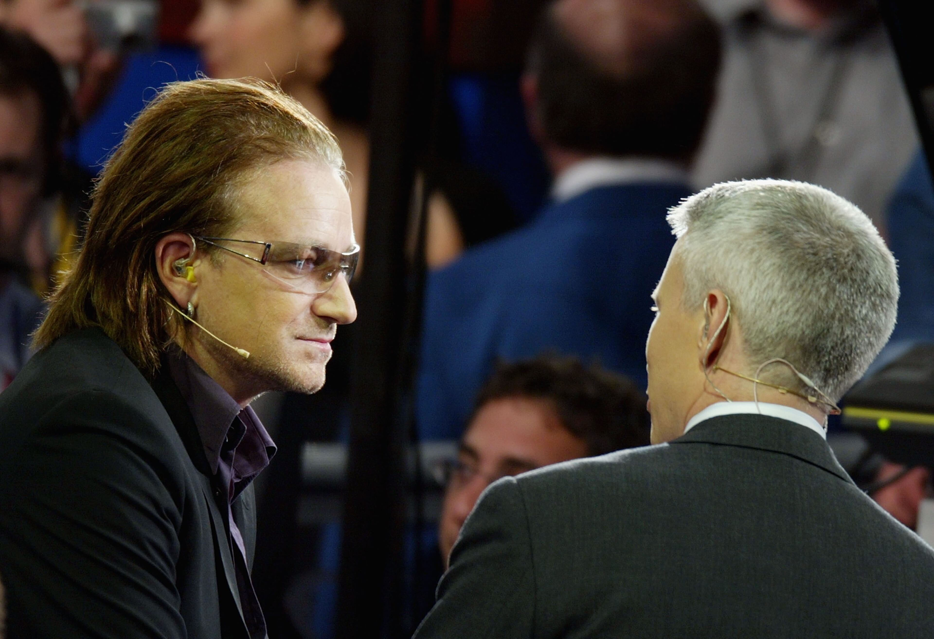 U2 lead singer Bono is interviewed by CNN's Anderson Cooper during the Democratic Convention at the FleetCenter July 27, 2004 in Boston, Massachusetts. (Photo by Mark Wilson/Getty Images)