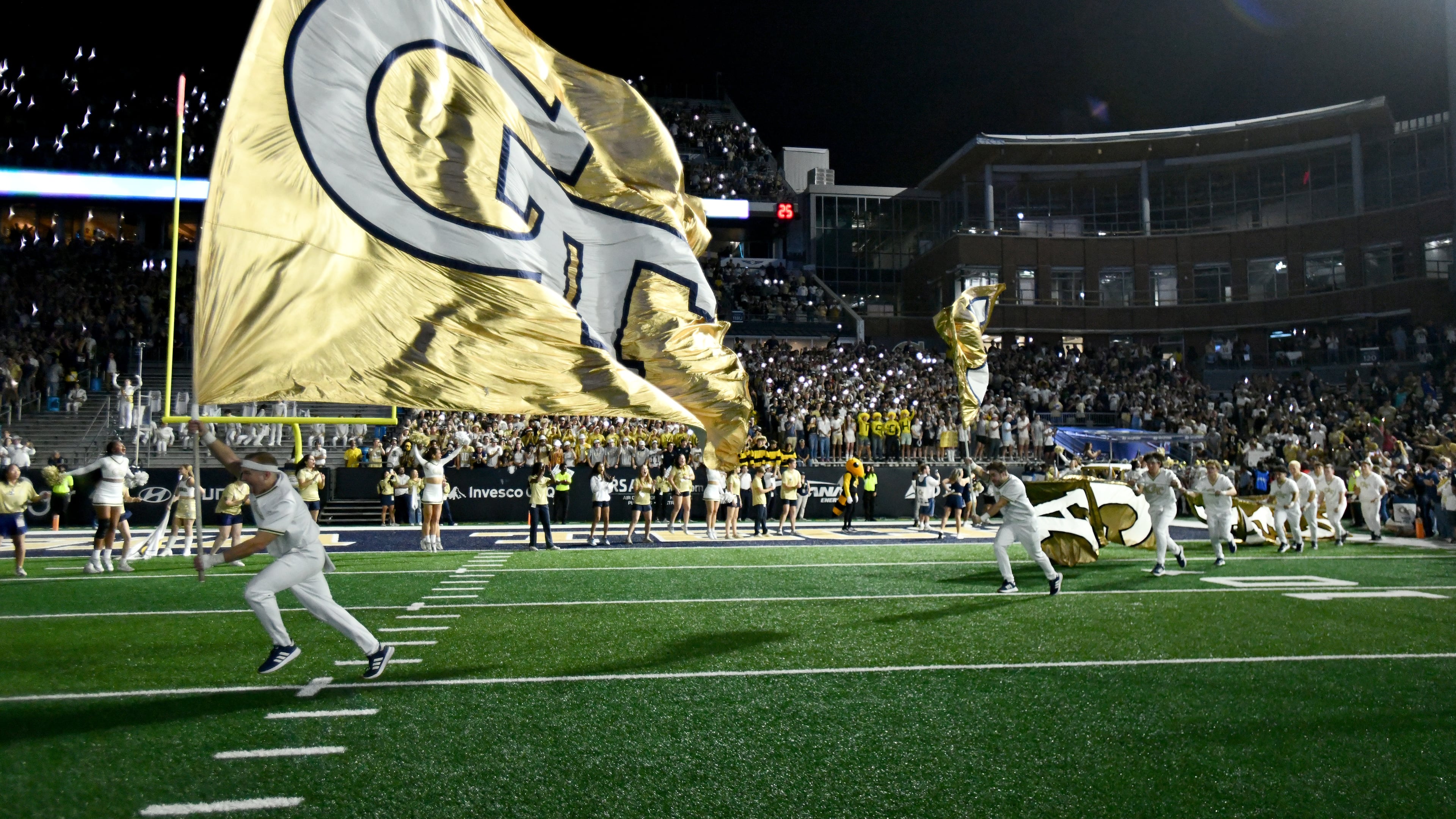 Georgia Tech's Ramblin' Wreck leads the band, cheerleaders, Buzz, players, and coaches before the start of the final regular-season home game against Pittsburgh at Bobby Dodd Stadium, Saturday, Nov. 22, 2025 in Atlanta (Hyosub Shin/AJC)