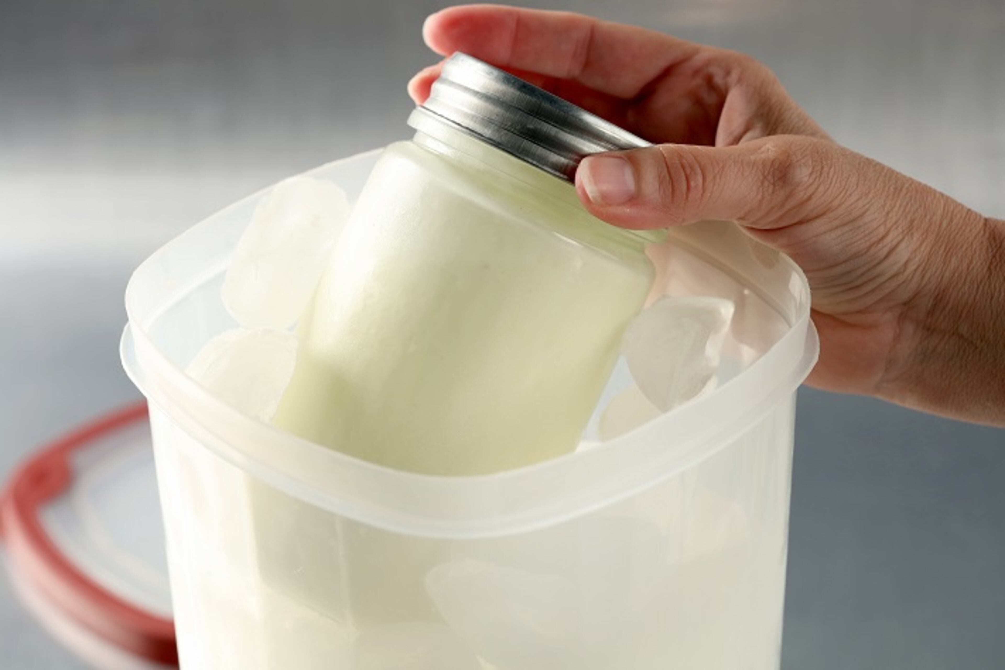 Fill the bottom of the larger container with salted ice, then slip in the smaller container with the base inside it. Pack the larger container full with ice. Then seal with the lid. (Michael Tercha/Chicago Tribune/TNS)