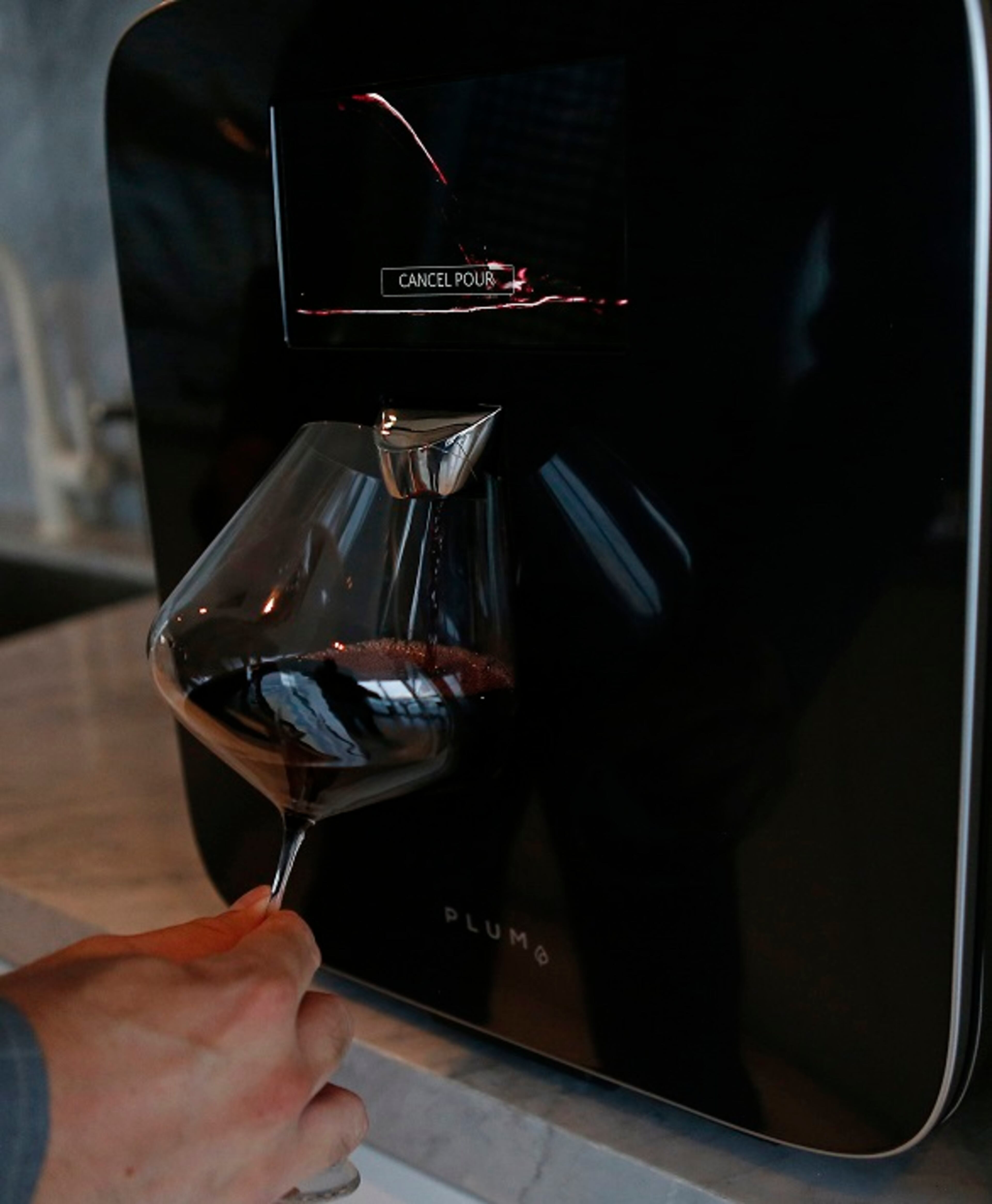 David Koretz, CEO of Plum, shows how the Plum works at his home on Wednesday, Sept. 6, 2017 in Miami, Fla. David Koretz' company Plum has created a high-tech wine appliance that serves wine at the perfect temperature and can save it for months, still serving wine as it was intended. (David Santiago/Miami Herald/TNS)