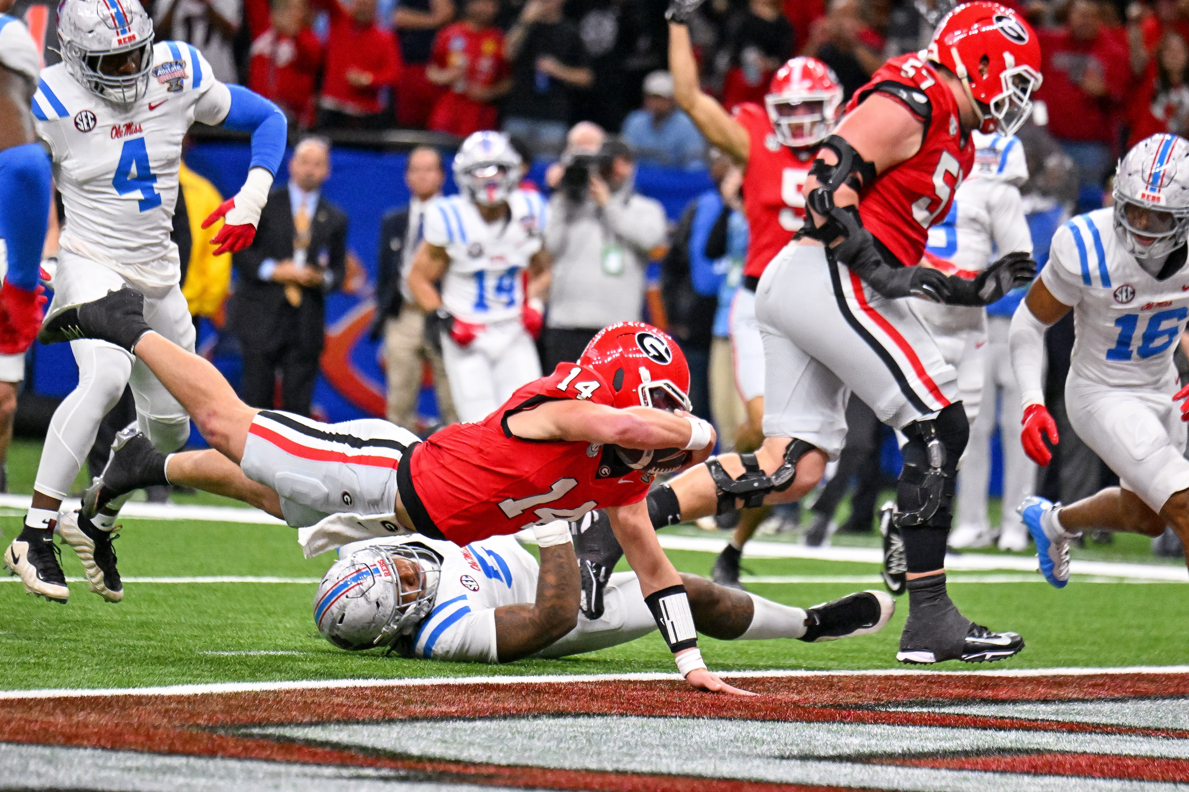 Georgia quarterback Gunner Stockton dives into the end zone for a 12-yard touchdown run against Ole Miss during the Sugar Bowl on Thursday, Jan. 1, 2026, in New Orleans. Stockton completed 18 of 31 pass attempts for 203 yards and a touchdown against the Rebels. (Hyosub/AJC)