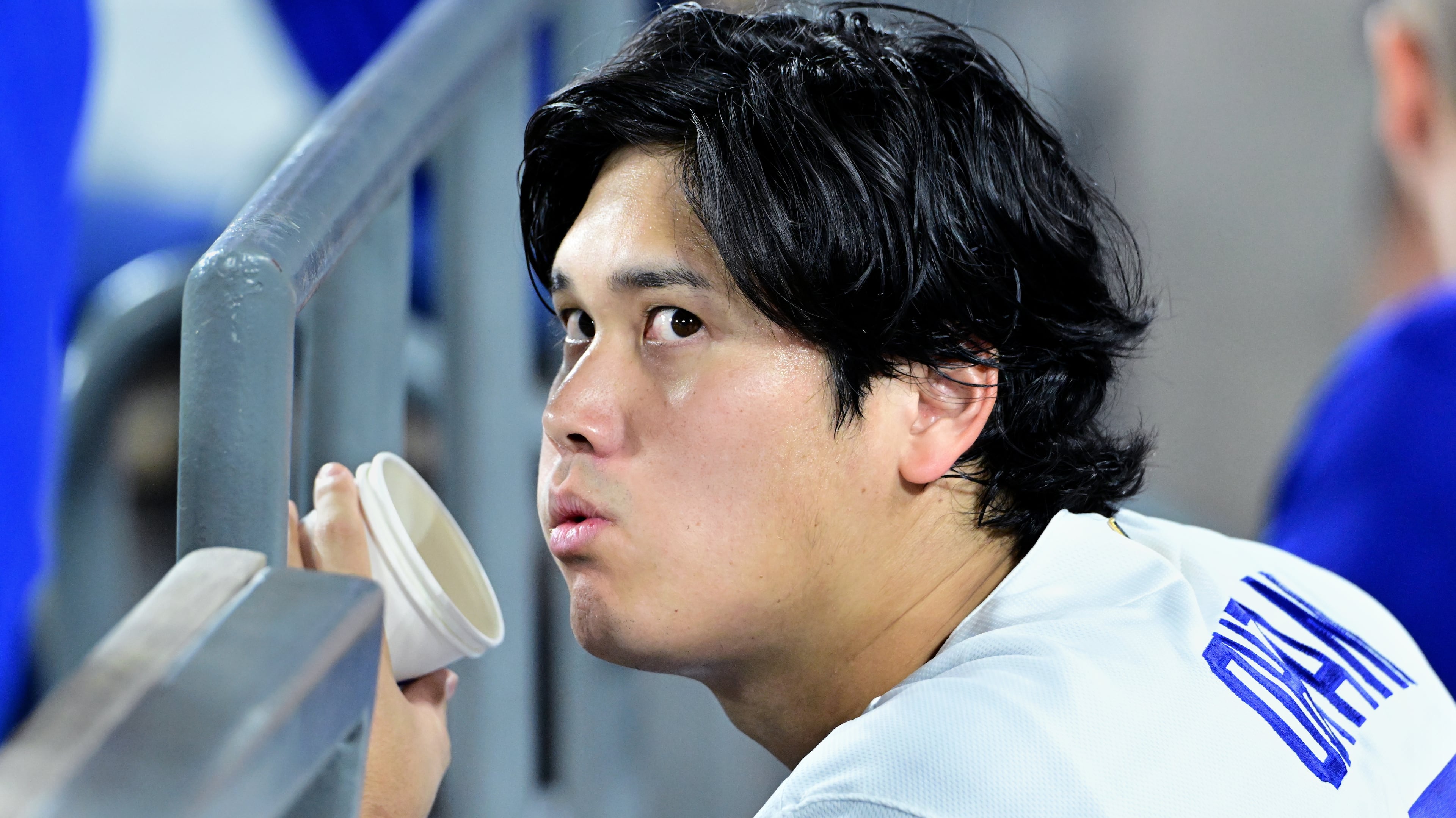 Los Angeles Dodgers Shohei Ohtani (17) watches from the dugout during the seventh inning of a baseball game against the Seattle Mariners, Tuesday, July 28 2026, in Los Angeles. (AP Photo/Wally Skalij)
