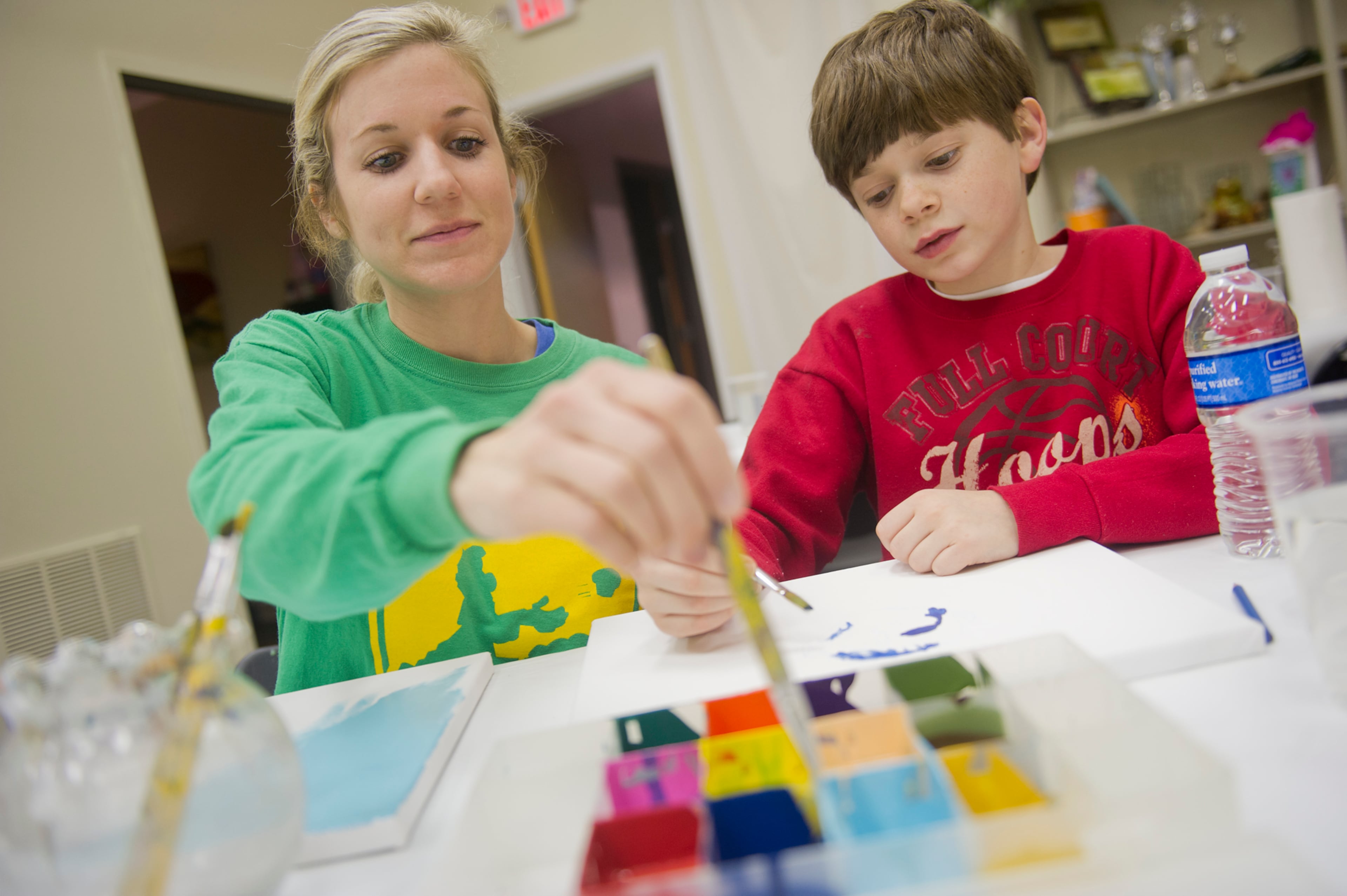 Kristi White (left) paints with son Bryce during Mother-Son Date Night at Saville Studios in Peachtree City on Saturday, Feb. 15, 2014. JONATHAN PHILLIPS / SPECIAL
