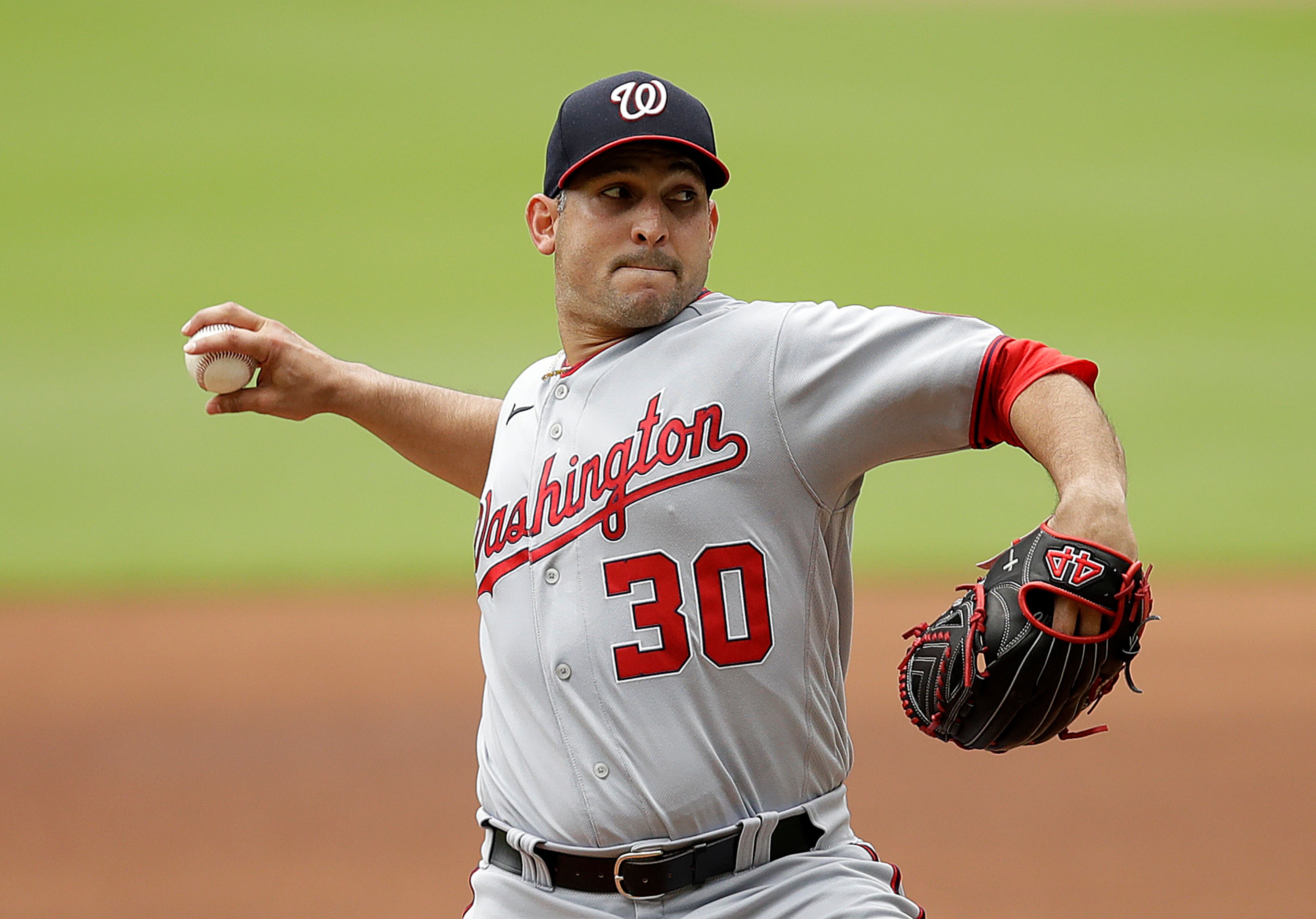 Nationals starter Paolo Espino works in the first inning of Sunday's Braves-Nationals game at Truist Park. (AP Photo/Ben Margot)