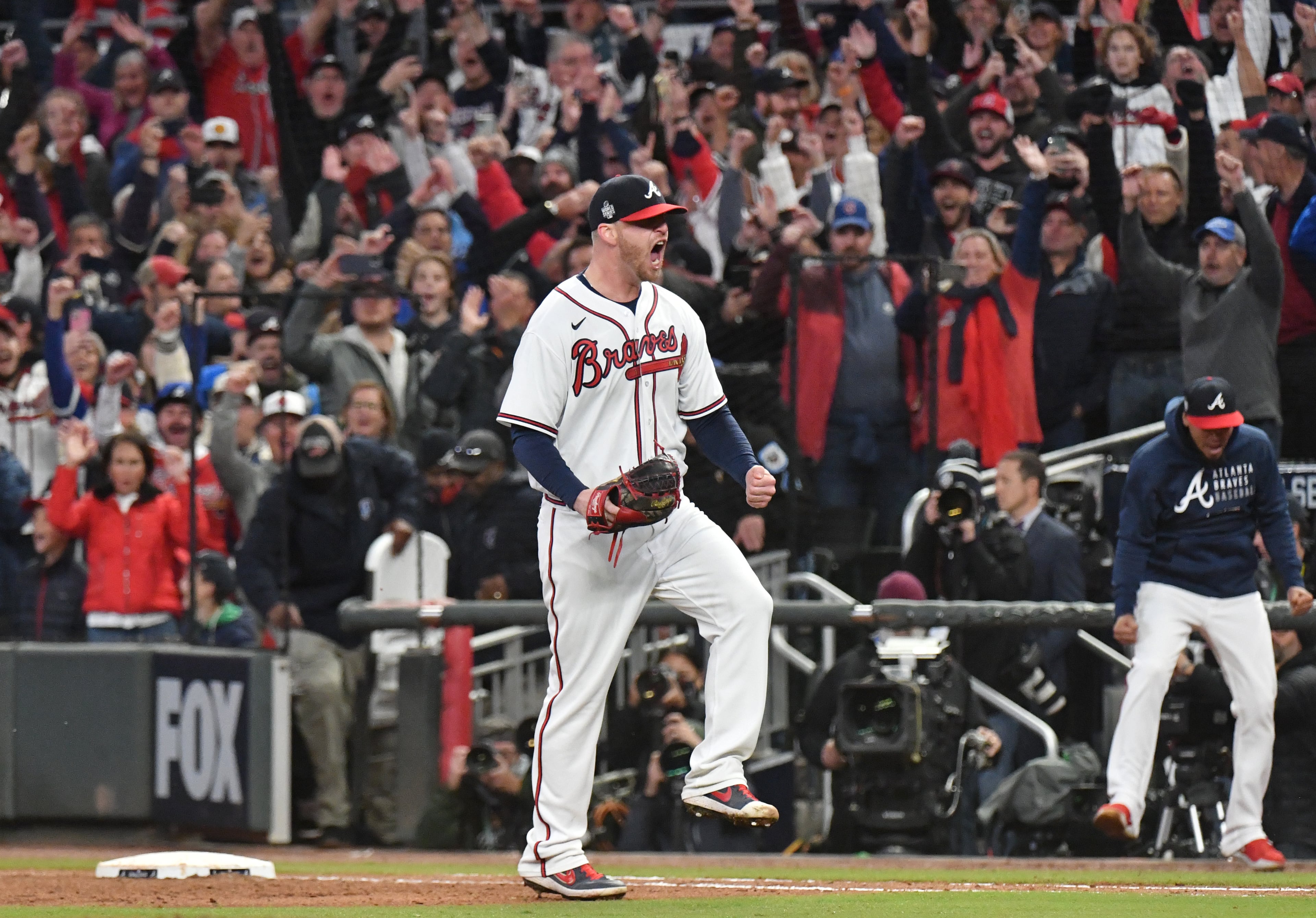 October 30, 2021 Atlanta - Atlanta Braves relief pitcher Will Smith (51) celebrates their victory over Houston Astros during Game 4 of baseball's World Series between Atlanta Braves and Houston Astros at Truist Park in Atlanta on Saturday, October 30, 2021. (Hyosub Shin / Hyosub.Shin@ajc.com)