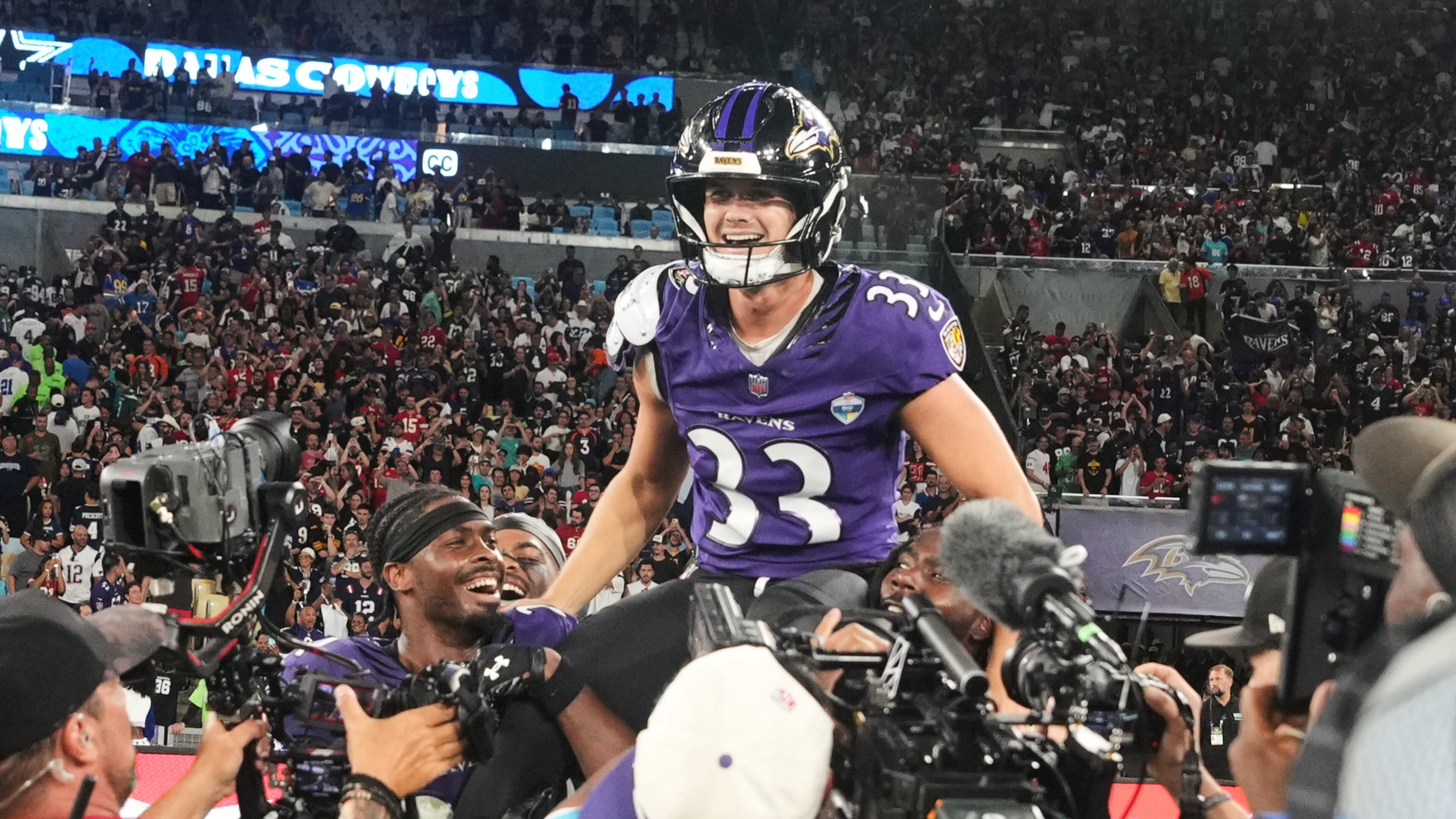 Baltimore Ravens place kicker Tyler Loop (33) celebrates after winning an NFL football game against the Dallas Cowboys in Rio de Janeiro, Sunday, Sept. 27, 2026. (AP Photo/Fernando Llano)