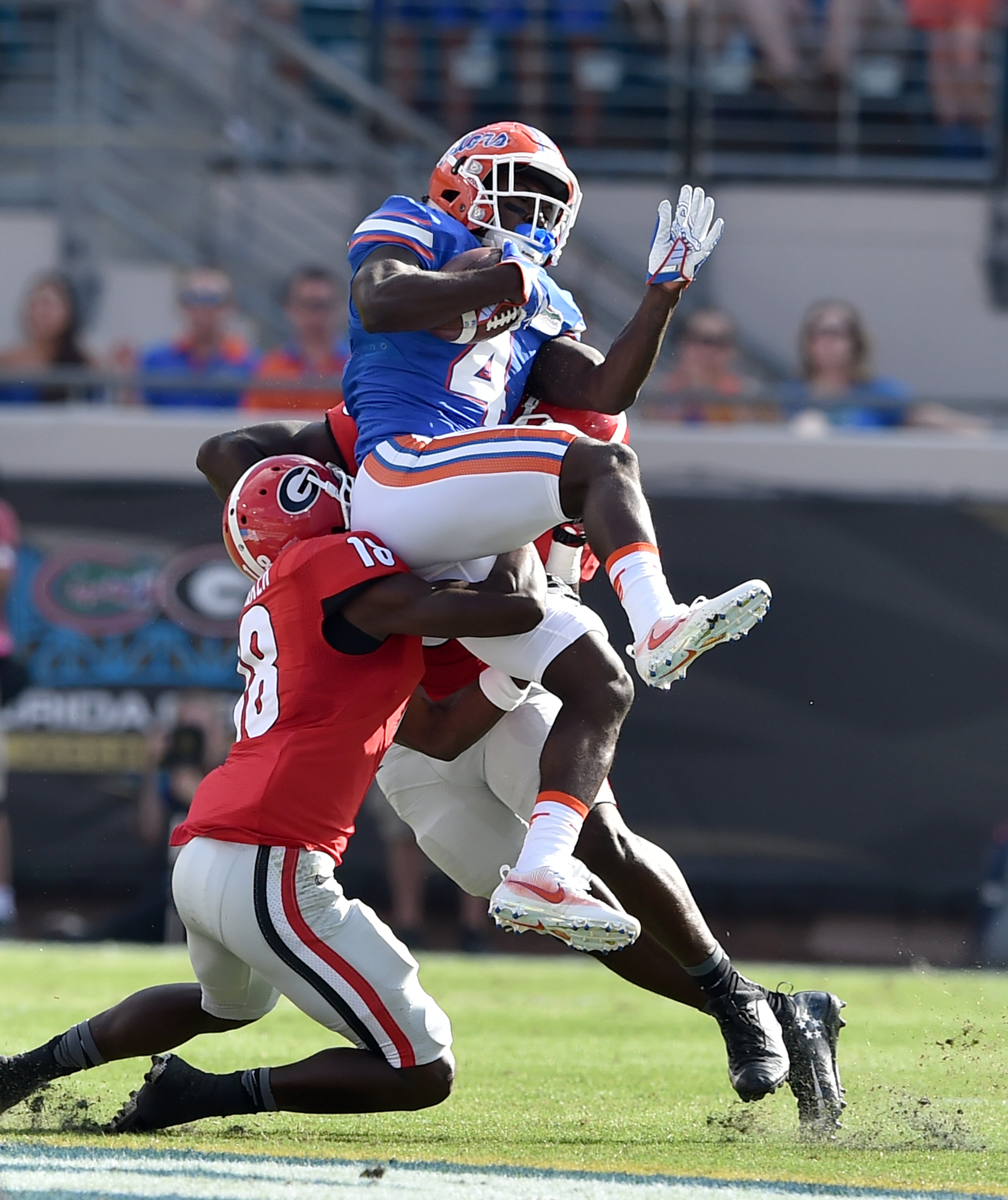 October 29 Jacksonville, FL : Florida Gators wide receiver Brandon Powell hauls in a pass in front of Georgia Bulldogs cornerback Deandre Baker during the first quarter at EverBank Field in Jacksonville Saturday October 29, 2016. BRANT SANDERLIN/BSANDERLIN@AJC.COM