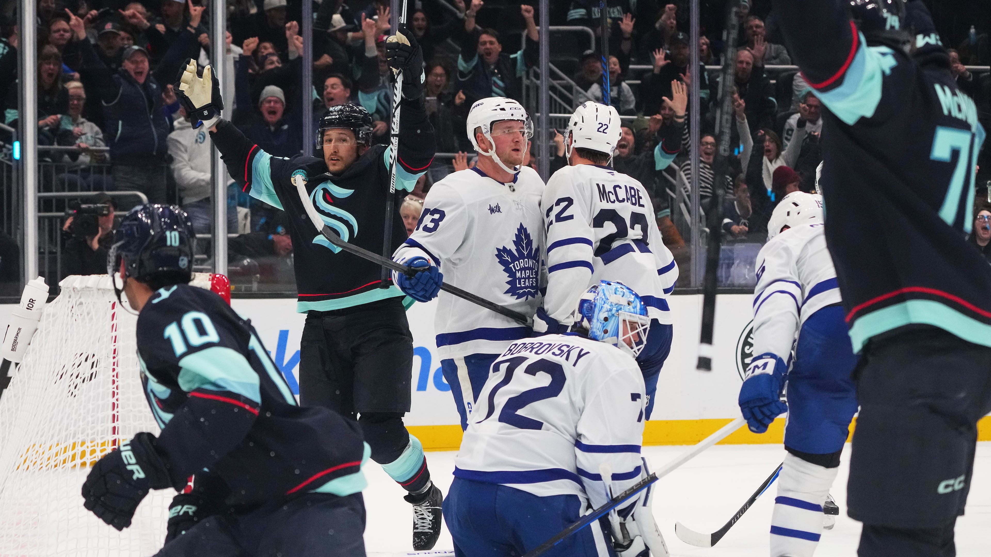 Seattle Kraken defenseman Brandon Montour, second from left, celebrates after making the game-winning goal late during the third period of an NHL hockey game against Toronto Maple Leafs goaltender Sergei Bobrovsky (72), Wednesday, Oct. 28, 2026, in Seattle. (AP Photo/Lindsey Wasson)