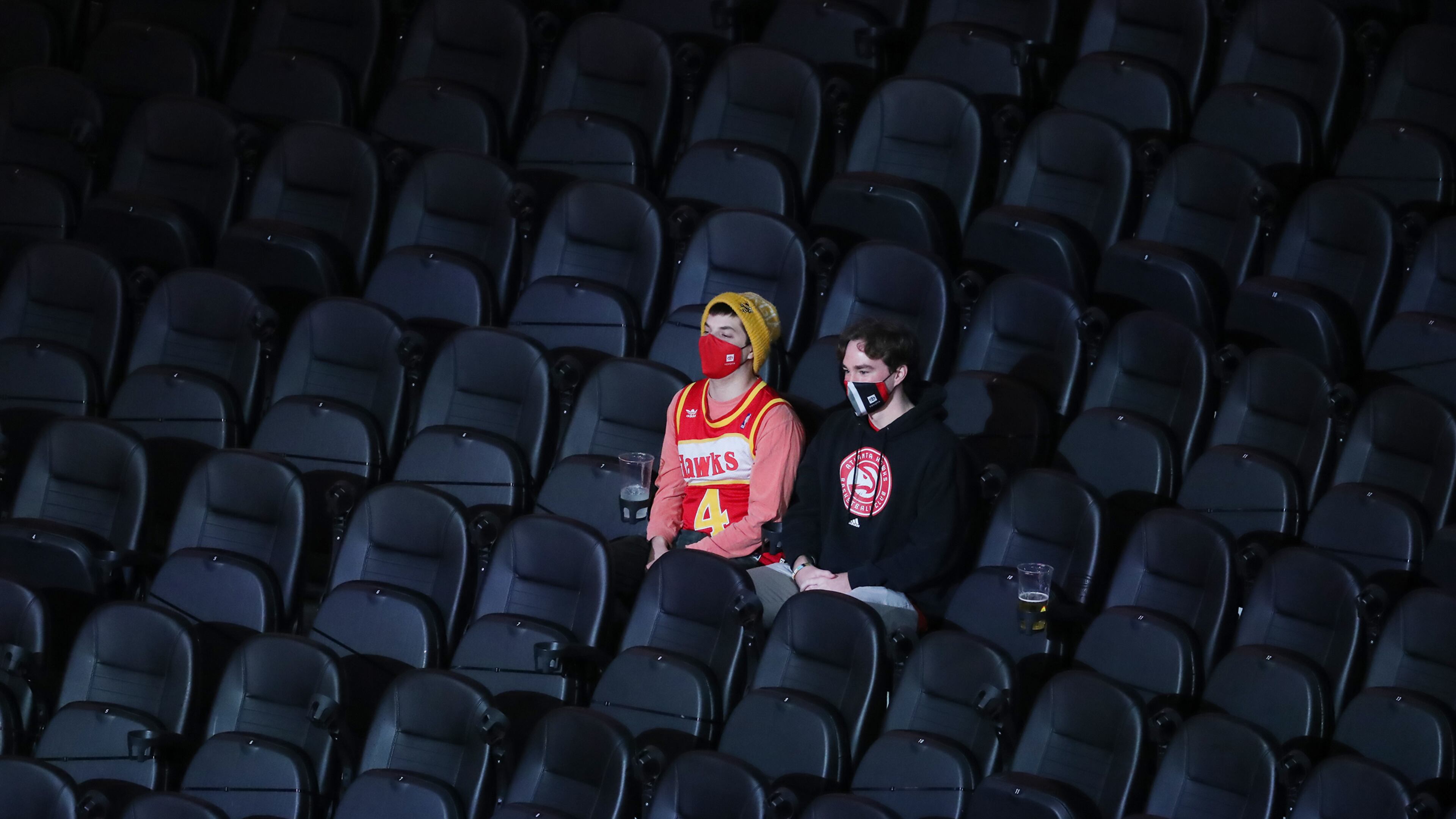 122820 ATLANTA: The seats are mostly empty with the exception of a few guests while the Atlanta Hawks play their home opener against the Detroit Pistons in a NBA basketball game on Monday, Dec. 28, 2020, in Atlanta. “Curtis Compton / Curtis.Compton@ajc.com”