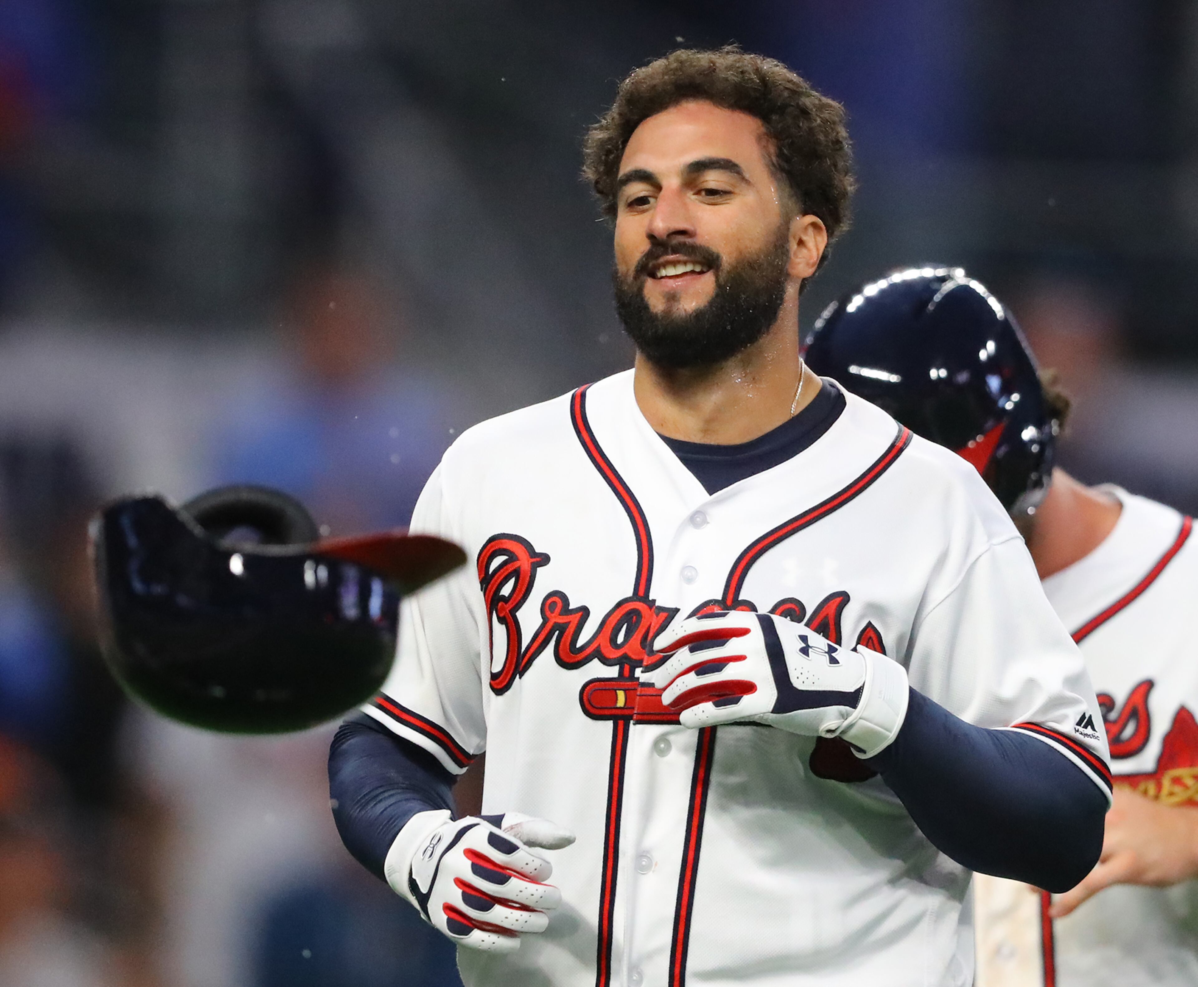 March 29, 2018 Atlanta: Atlanta Braves outfielder Nick Markakis tosses his helmet after hitting a walk off 3-RBI home run to beat the Phillies 8 to 5 in a MLB baseball home opening game on Thursday, March 29, 2018, in Atlanta. Curtis Compton/ccompton@ajc.com