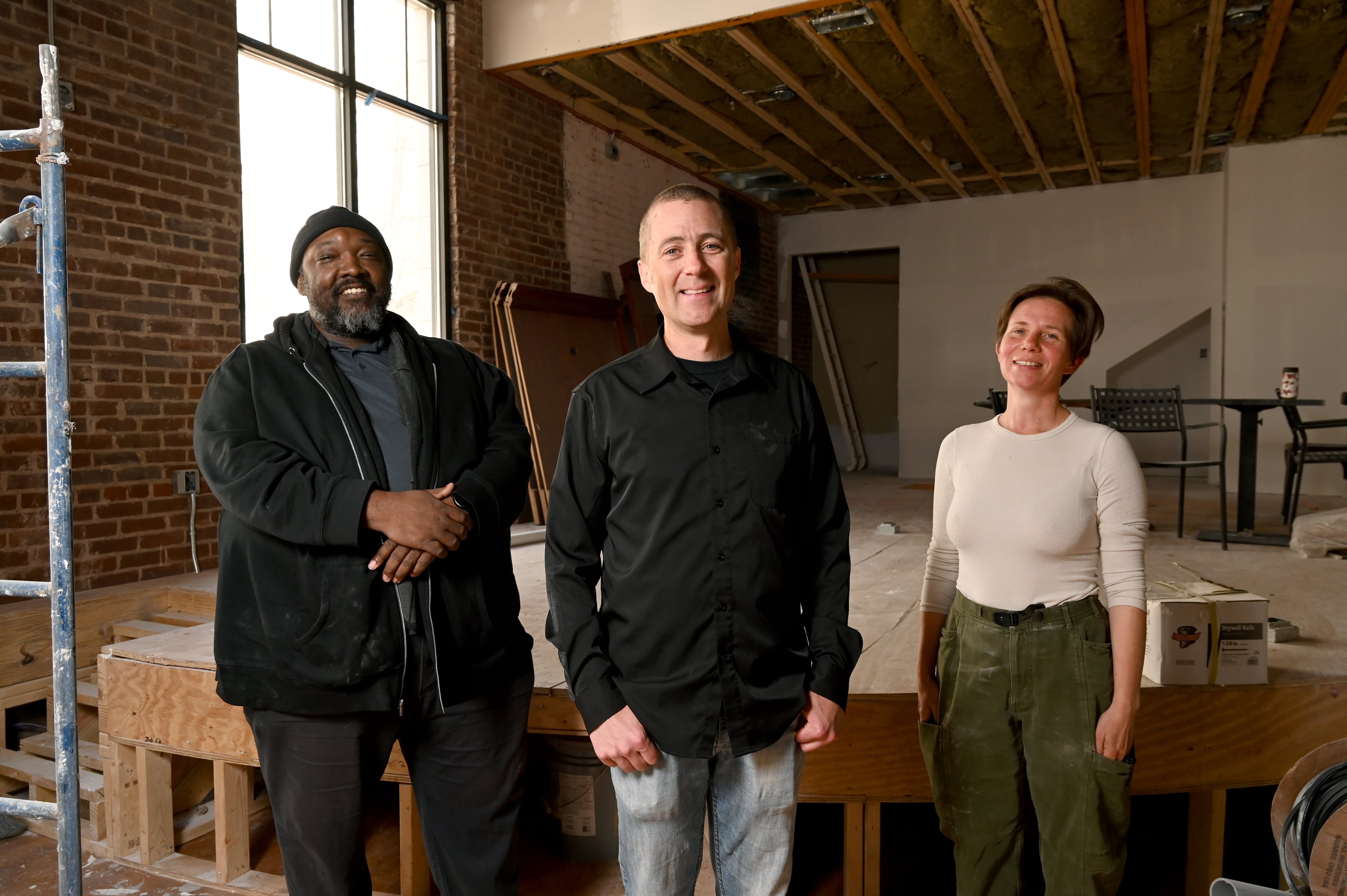 Will Scruggs (center), jazz saxophonist and founder of the Cornerstone Jazz Collective, poses with Kevin Smith (left), musician, and Leah Calvert, general contractor, at their new venue Mary Lou Williams Jazz Center, which will become the new home of the famed Atlanta jazz venue Churchill Grounds, which closed in 2016, Thursday, March 26, 2026, in Decatur. (Hyosub Shin/AJC)
