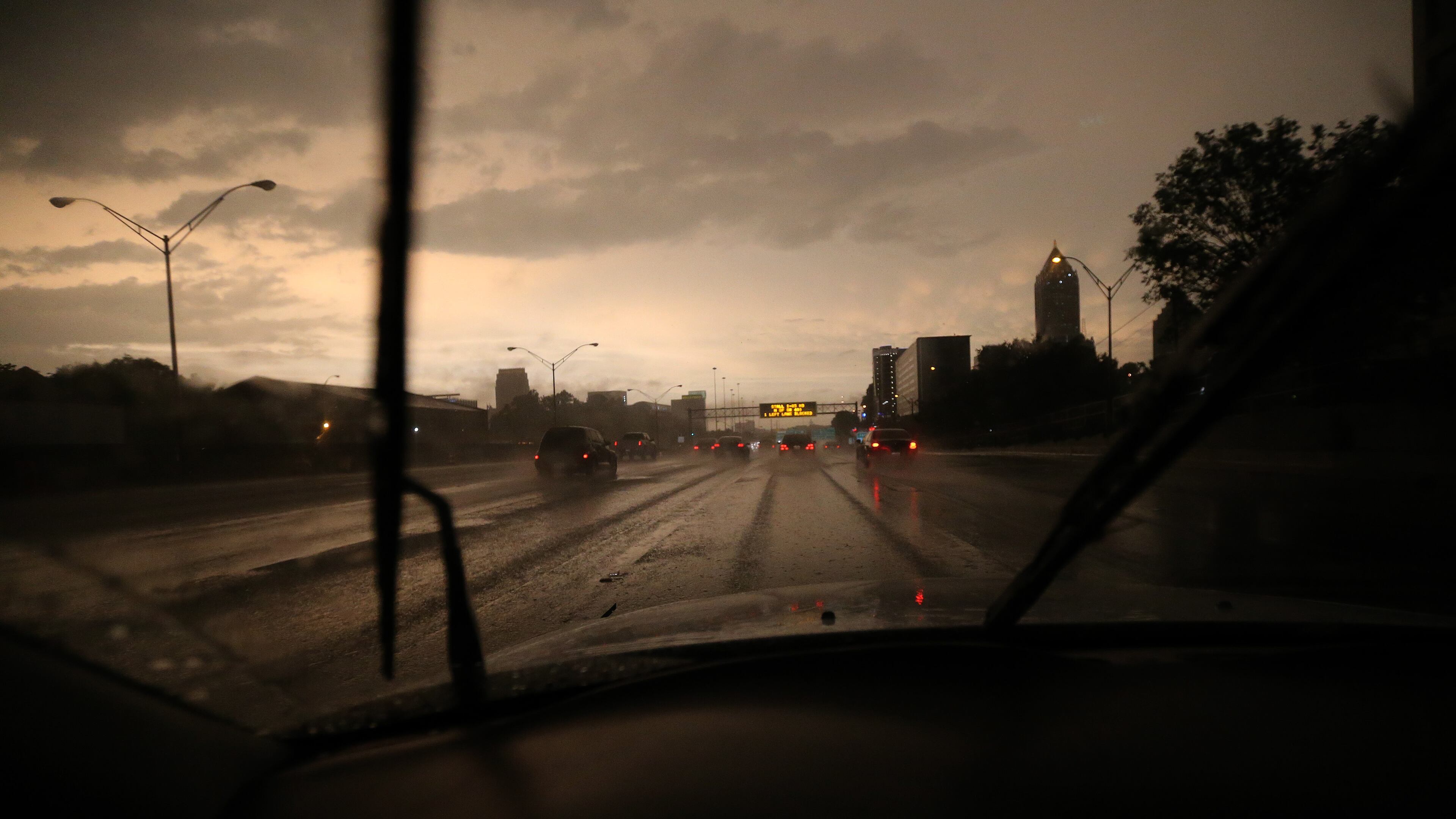 Post-storm clouds catch the setting sun on the Connector in midtown Atlanta on Thursday evening, June 13, 2013.
