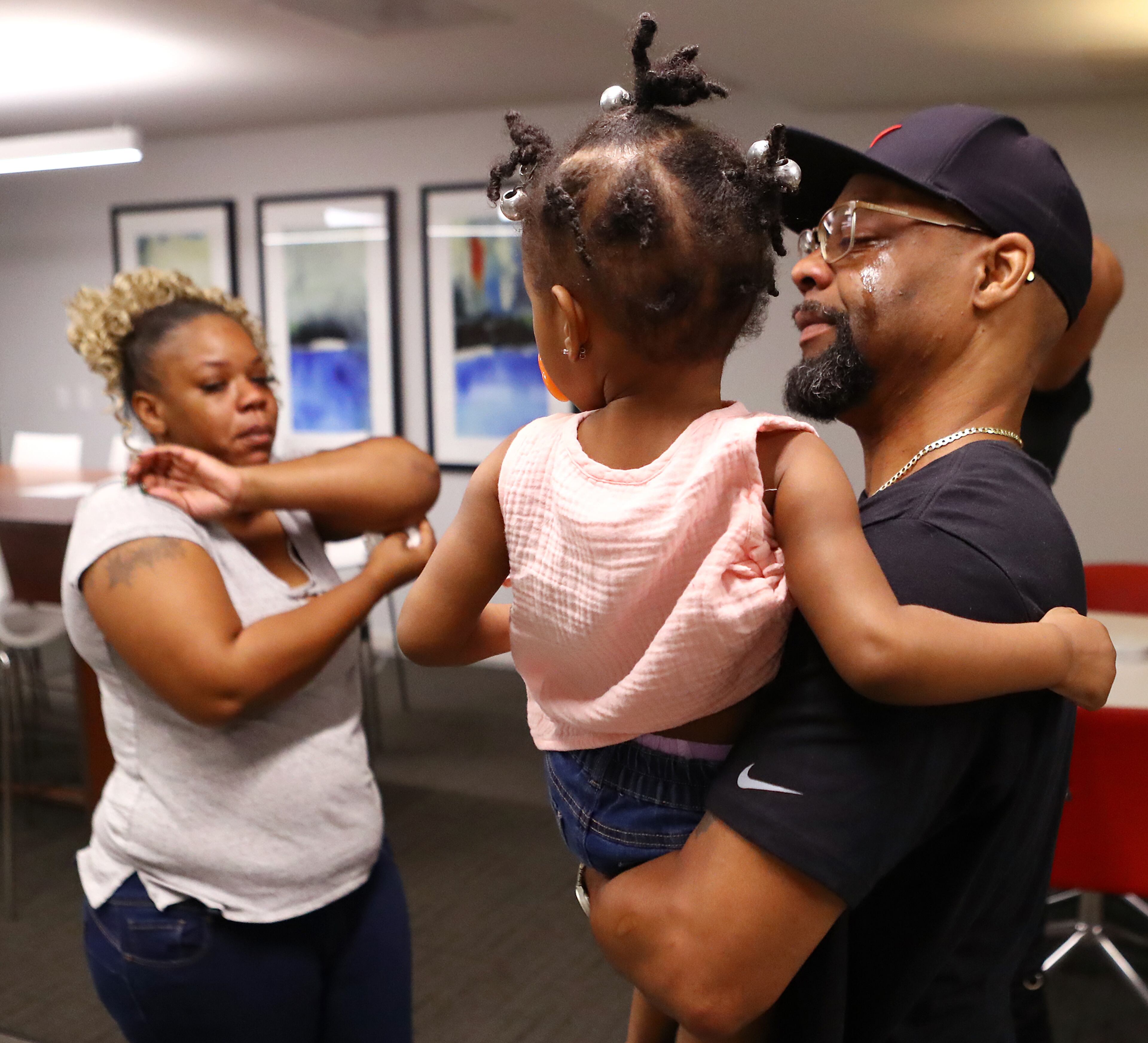 061520 Atlanta: Tomika Miller, the wife of Rayshard Brooks, their daughter Memory, 2, and Gymaco Brooks, his cousin, leave the family press conference after becoming emotional on Monday, June 15, 2020, in Atlanta. Brooks was killed by an APD officer Friday and the heartbroken family was determined that his death spark positive change. Curtis Compton ccompton@ajc.com