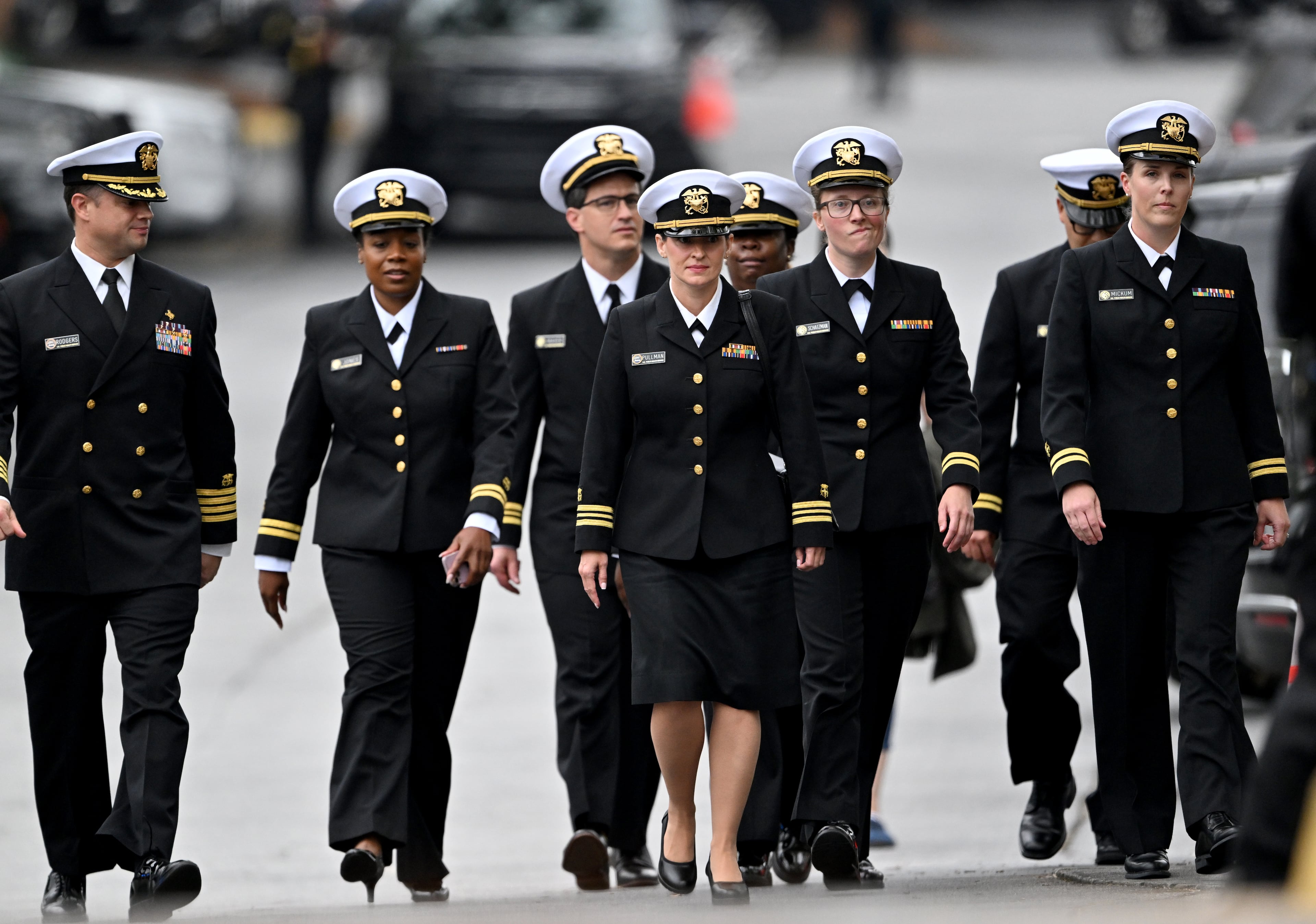 Mourners from the Department of Health & Human Services arrive before the memorial service for DeKalb County police Officer David Rose, who was killed while responding to the Aug. 8 shooting at the CDC. (Hyosub Shin/AJC)