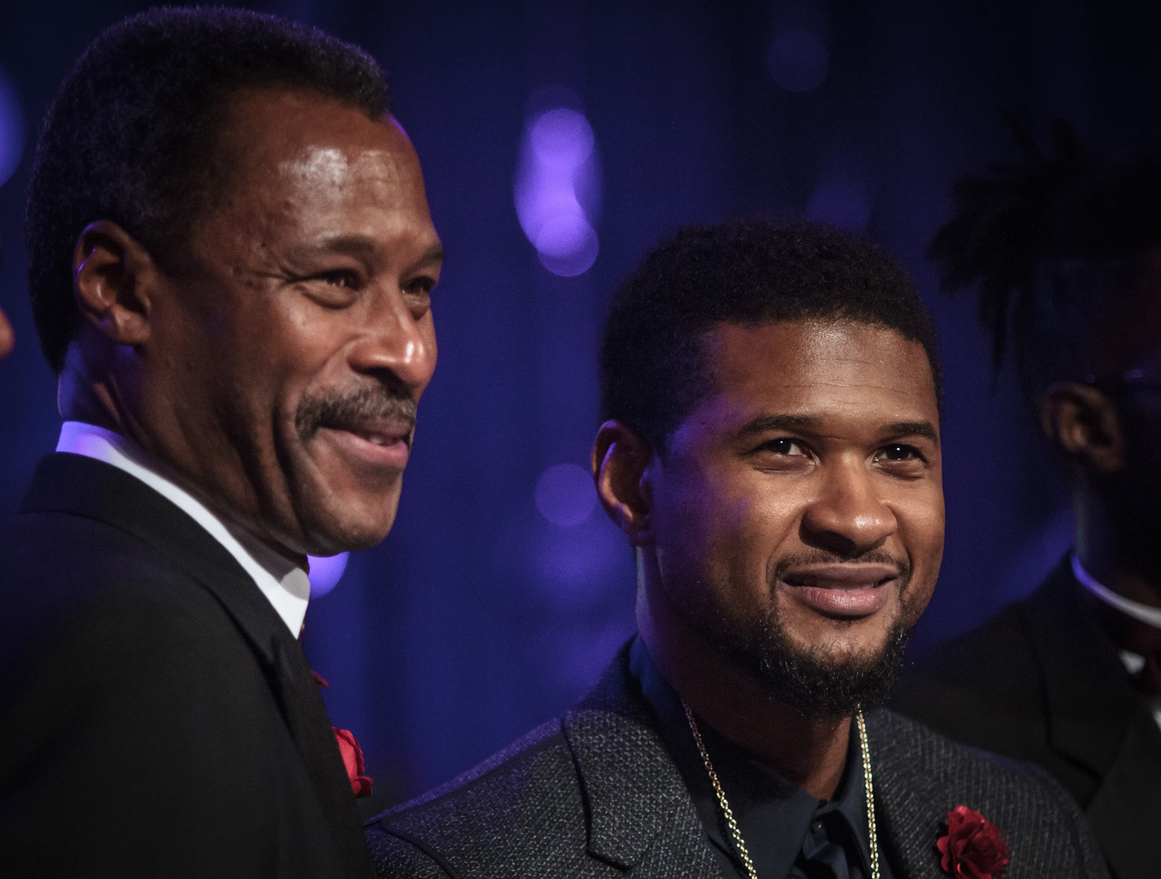 Grammy-award winning musical artist Usher Raymond (R) stands with Morehouse President John Wilson after being awarded the Bennie and Candle award during the Candle In The Dark Gala, in Atlanta Ga February 18, 2017. STEVE SCHAEFER / SPECIAL TO THE AJC