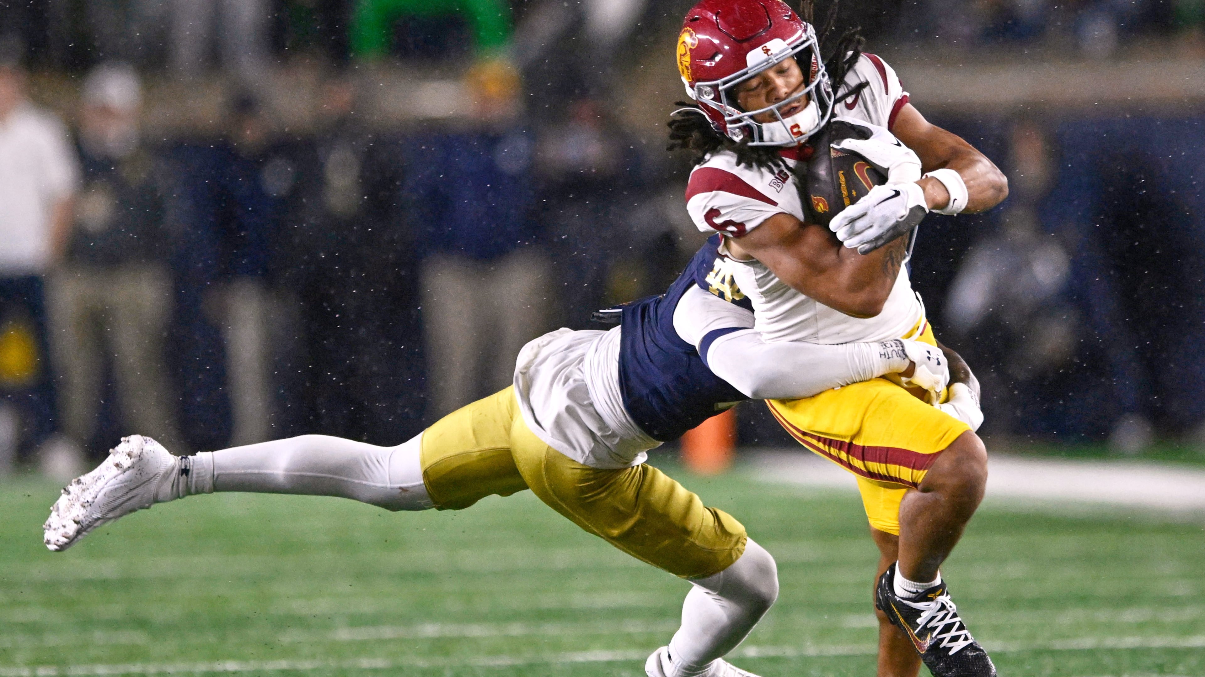 FILE - Southern California wide receiver Makai Lemon (6) catches a pass against Notre Dame's Tae Johnson (9) during the fourth quarter of an NCAA college football game, Oct. 18, 2025, in South Bend, Ind. (AP Photo/Paul Beaty, File)