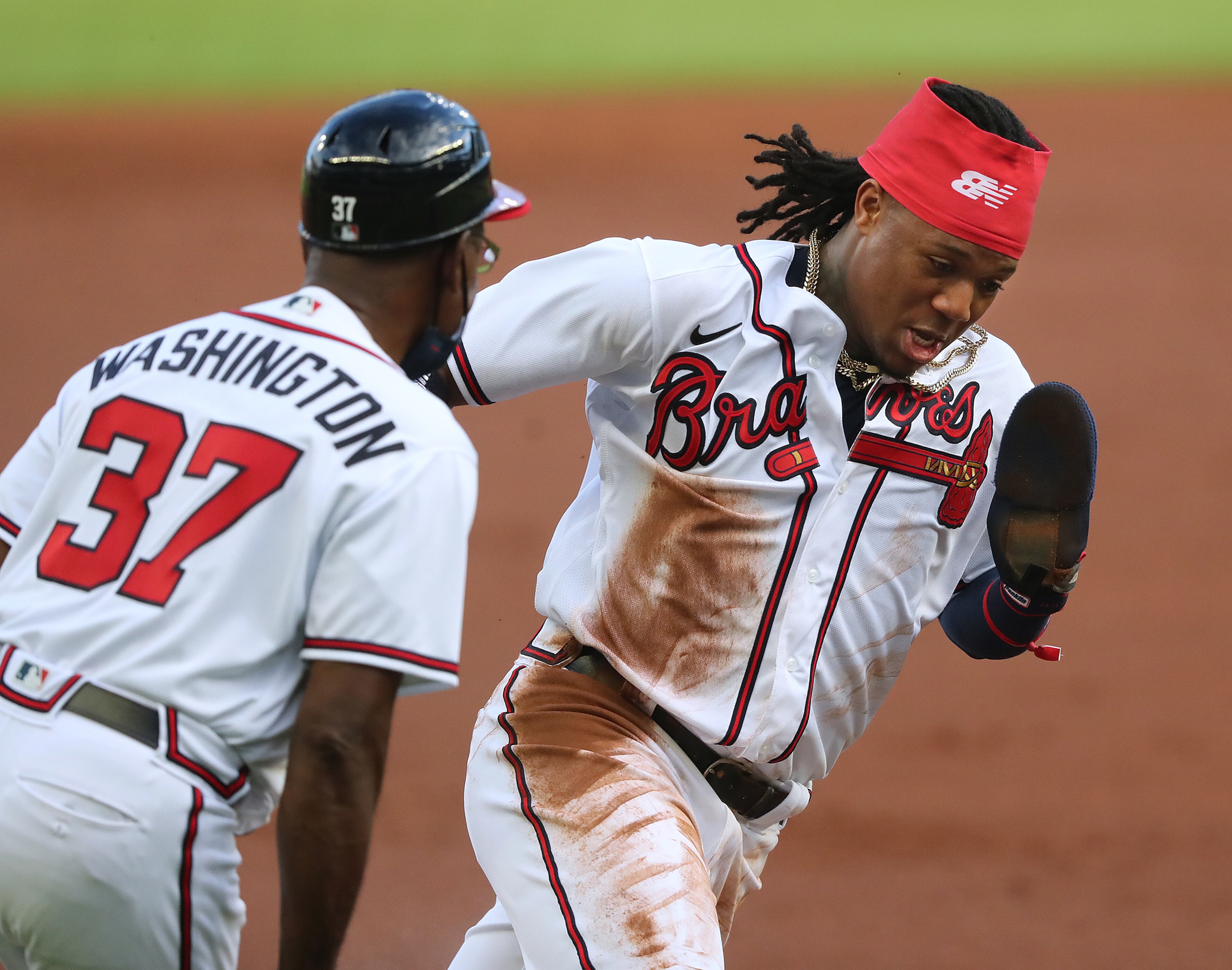 Braves third base coach Ron Washington looks on as Ronald Acuna rounds the bag and heads home only to be thrown out in the first inning of Wednesday's game. (Curtis Compton/ccompton@ajc.com)