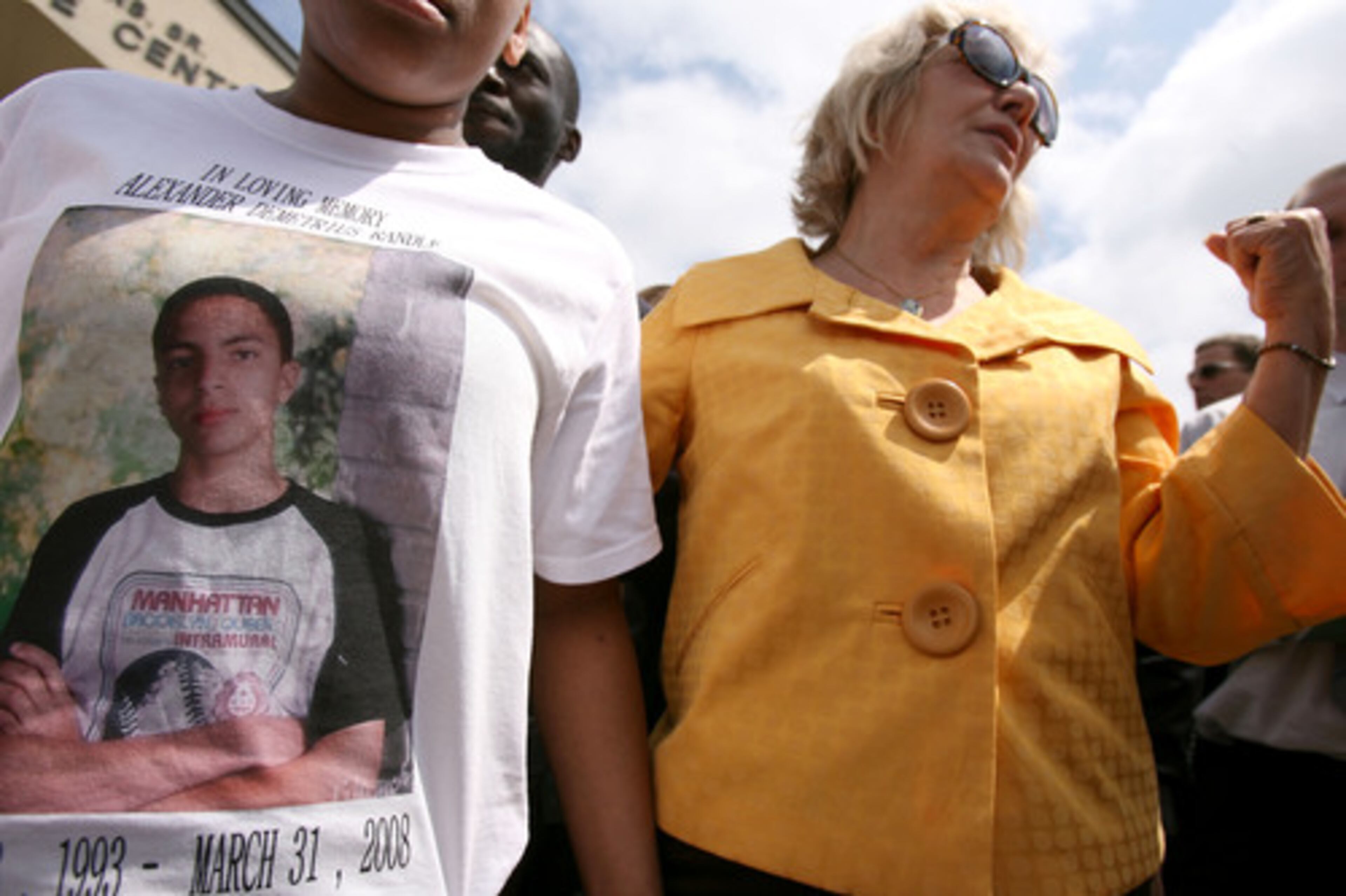 Molly Dubach Preston is the grandmother and great grandmother to the Randle family. She speaks to friends and family after the funeral service. Left is a t-shirt picture of Alexander Demetrius Randle.