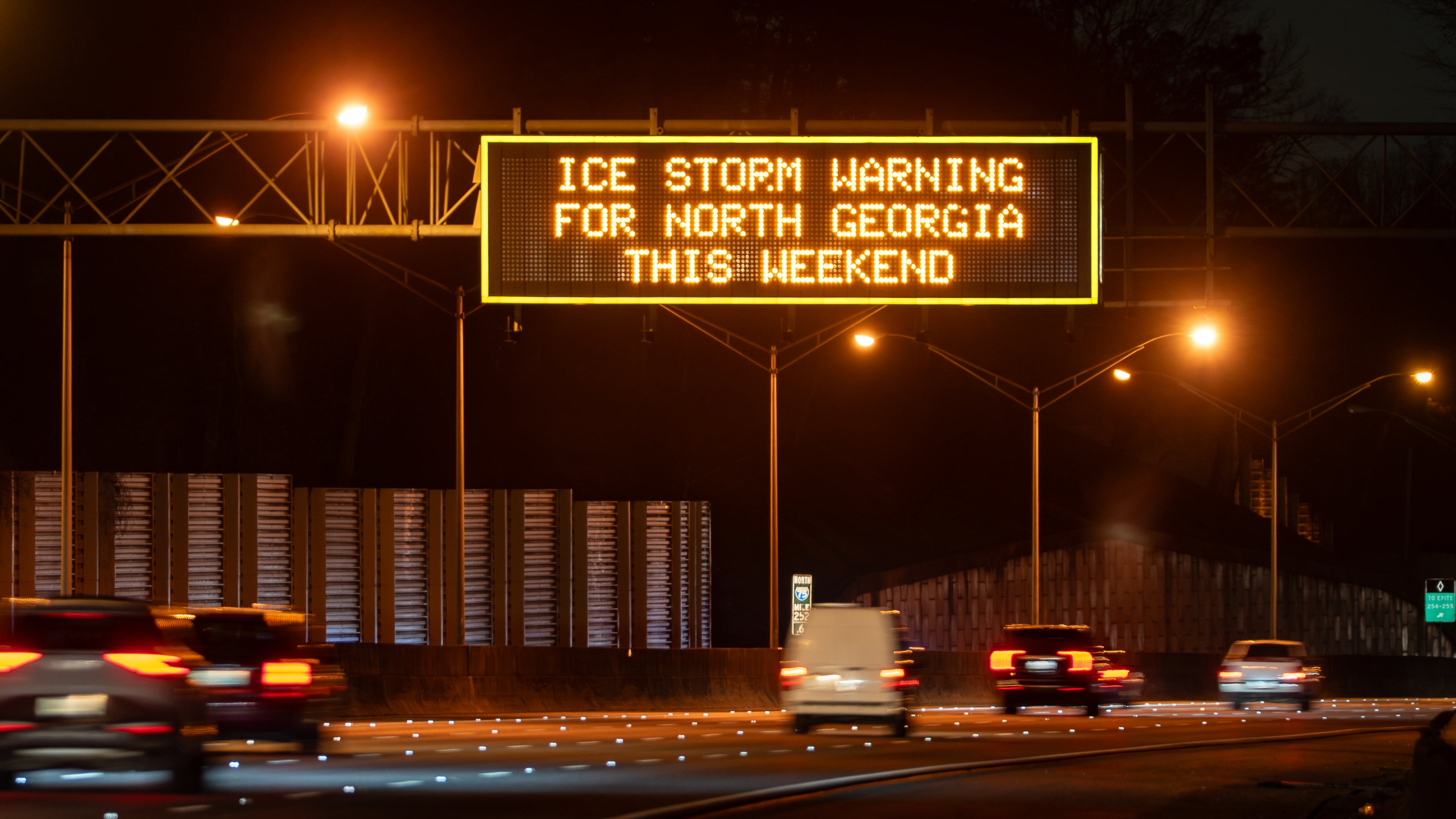 A Georgia Department of Transportation sign over I-75 Saturday Jan. 24, 2026, warns of the impending ice storm that will hit North Georgia this weekend. (Ben Hendren for the AJC)