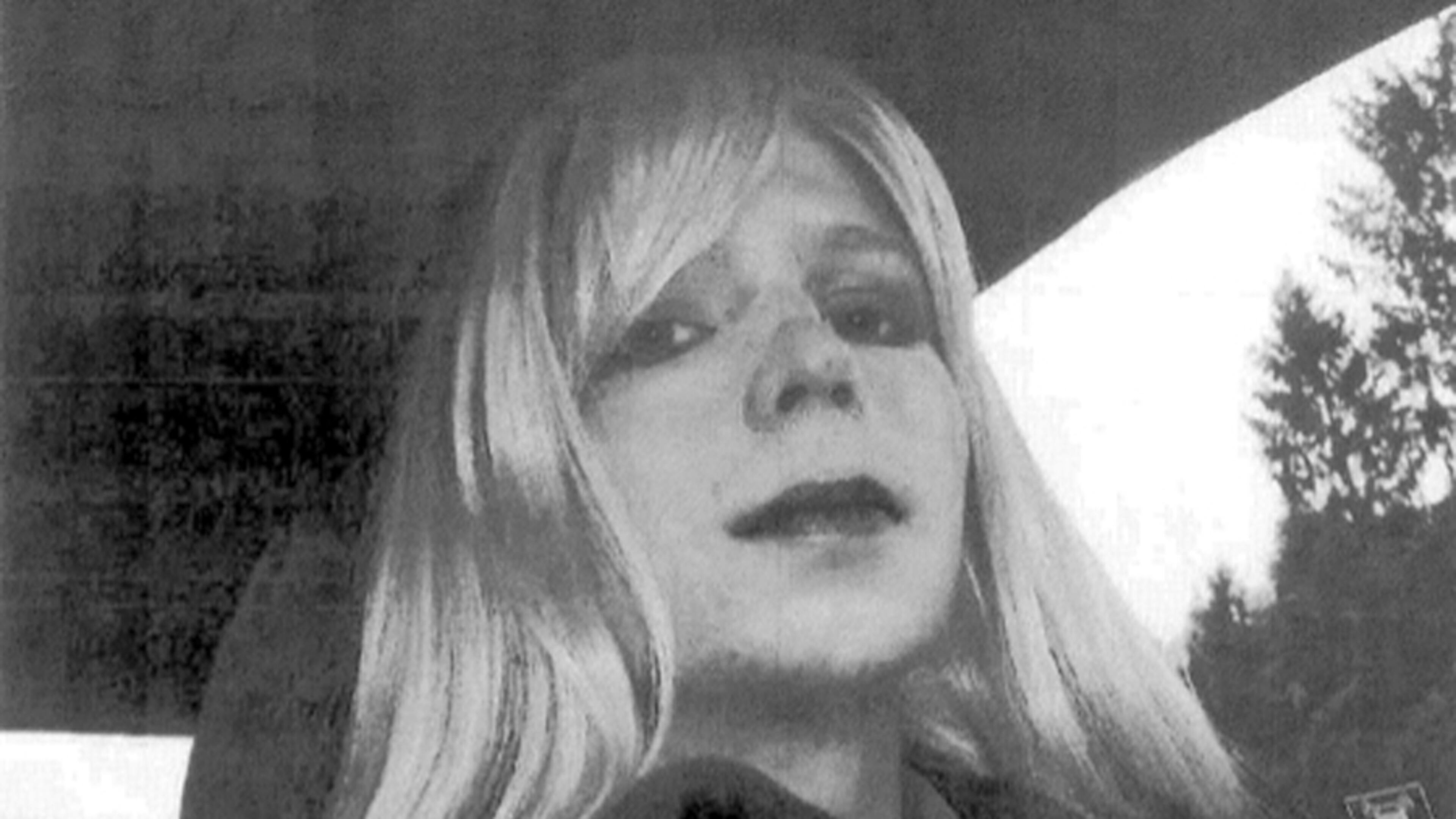 FILE - In this undated file photo provided by the U.S. Army Pfc. Chelsea Manning poses for a photo wearing a wig and lipstick. Manning, a transgender soldier imprisoned in Kansas for leaking classified information to the WikiLeaks website will end a hunger strike after the Army agreed to allow her to receive medical treatment for her gender dysphoria, the American Civil Liberties Union announced Tuesday, Sept. 13, 2016. (AP Photo/U.S. Army, File)