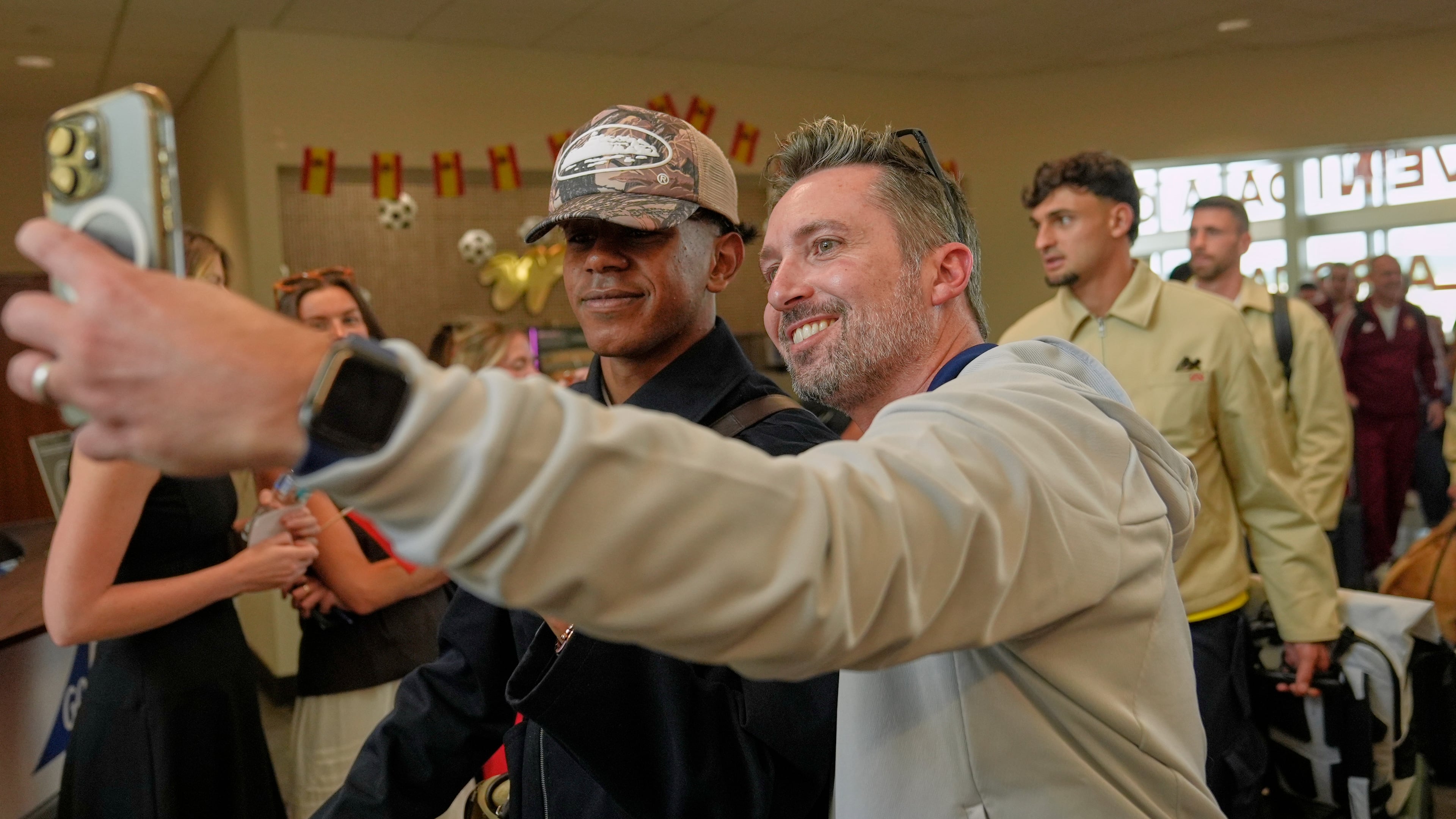 Derrall Stalvey, right, takes a selfie with Spain forward Lamine Yamal, left, after the team arrived for the World Cup soccer tournament Friday, June 5, 2026, in Chattanooga, Tenn. (AP Photo/George Walker IV)