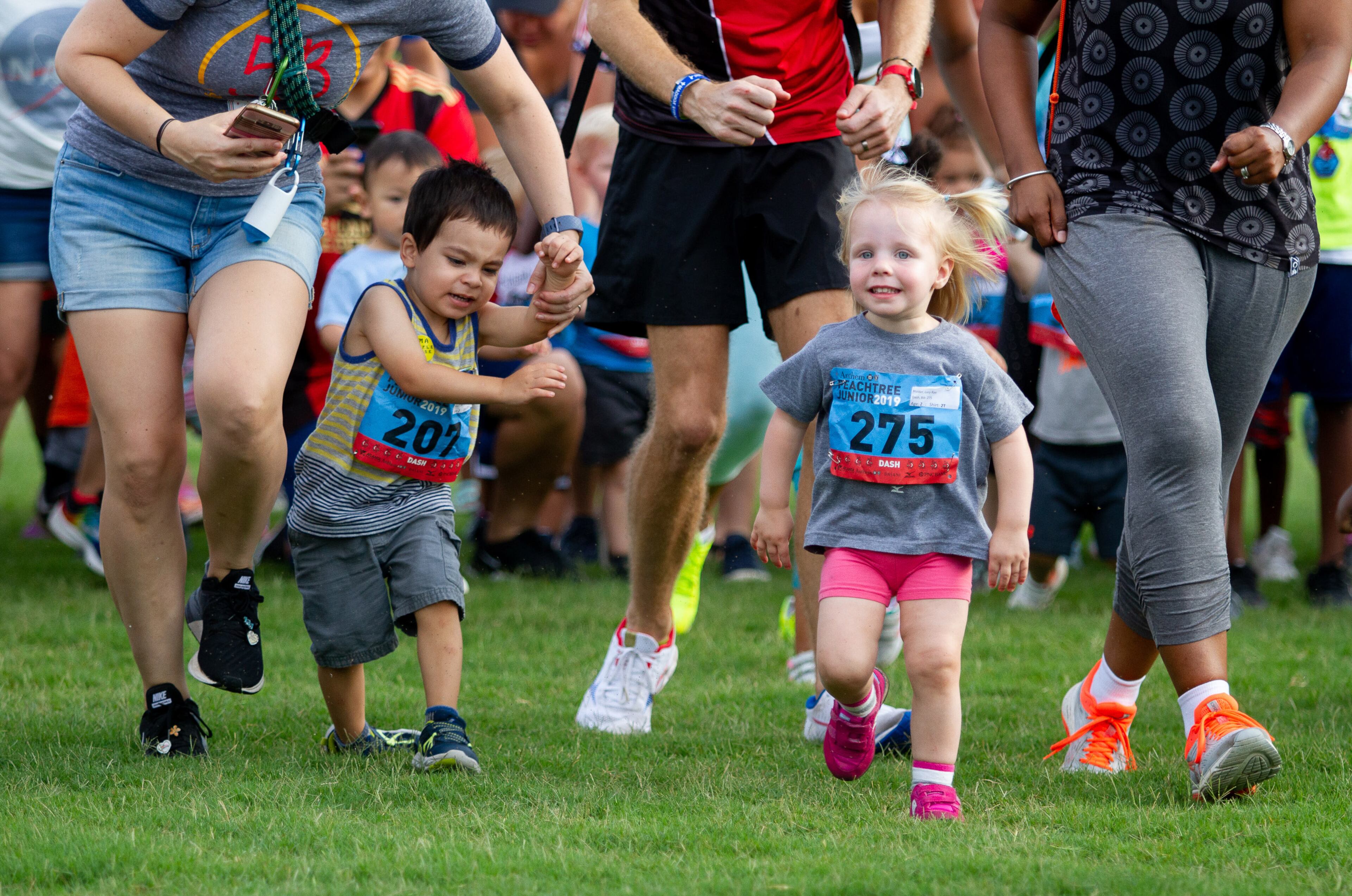 Parents encourage their kids during the two-year-old Dash during The Anthem Peachtree Junior race in Piedmont Park Wednesday, July 3, 2019. The Dash was open to kids ages 6 and under. STEVE SCHAEFER / SPECIAL TO THE AJC