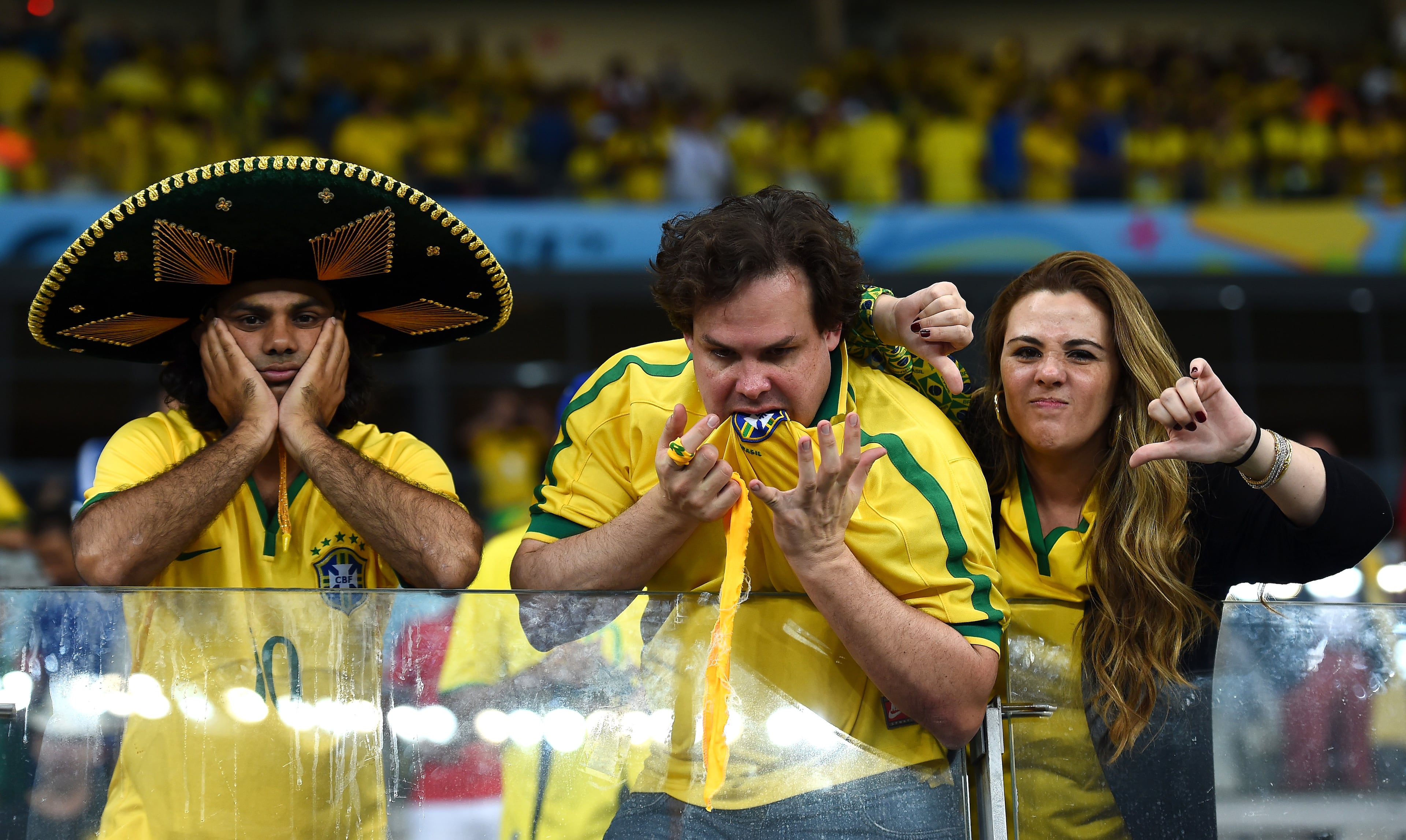 Emotional Brazil fans react after being defeated by Germany 7-1 during the 2014 FIFA World Cup Brazil Semi Final match between Brazil and Germany at Estadio Mineirao on July 8, 2014 in Belo Horizonte, Brazil. (Photo by Laurence Griffiths/Getty Images)