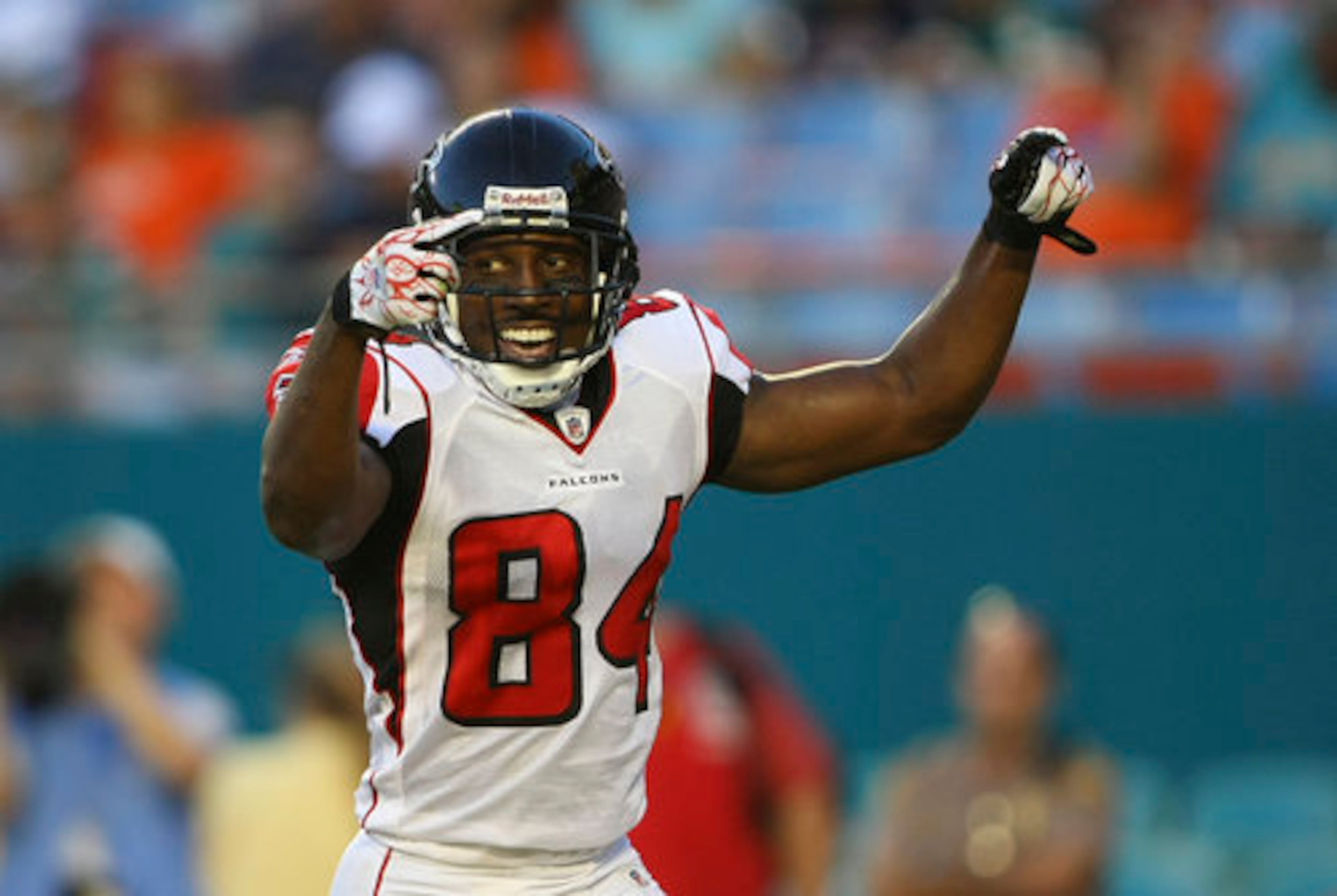 Atlanta Falcons wide receiver Roddy White celebrates a first quarter touch down in NFL preseason football action in Miami against the Miami Dolphins Friday, Aug. 27, 2010.