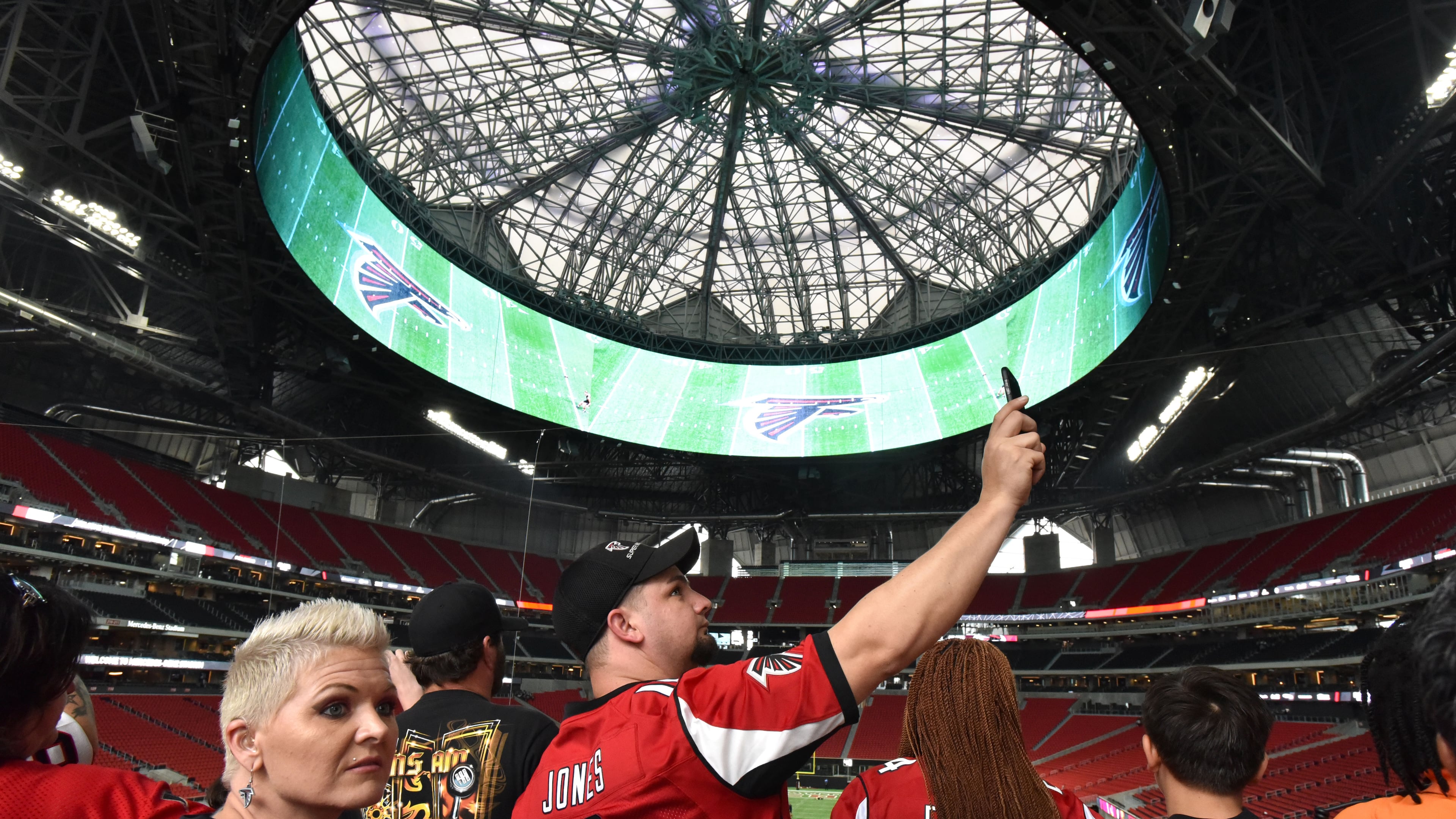 August 26, 2017 Atlanta - Atlanta Falcons fans walk through inside new Mercedes-Benz Stadium before an exhibition game against the Arizona Cardinals on Saturday, August 26, 2017. HYOSUB SHIN / HSHIN@AJC.COM