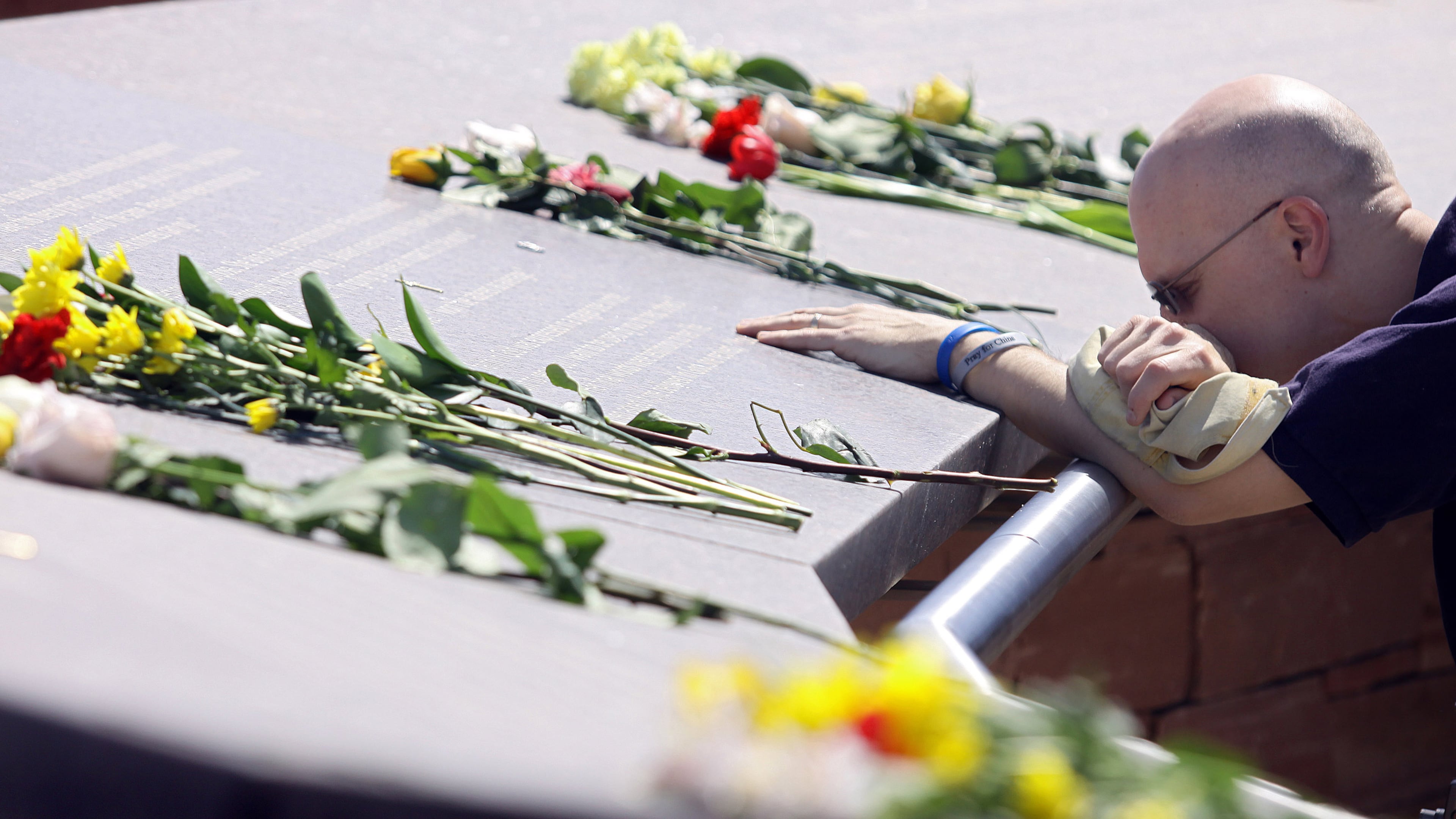 James Dann of Thornton, Colorado pauses at one of the names of the victims of the Columbine High School shootings on the ten-year anniversary at the Columbine Memorial Park April 20, 2009 in Littleton, Colorado. Dann was a DJ on a local radio station in Denver and said broadcasting that day was the "most difficult day of my career". Columbine was the site of the then deadliest school shooting in modern United States history when, on April 20, 1999, two shooters killed 12 students and one teacher, and wounded 23 others, before taking their own lives.