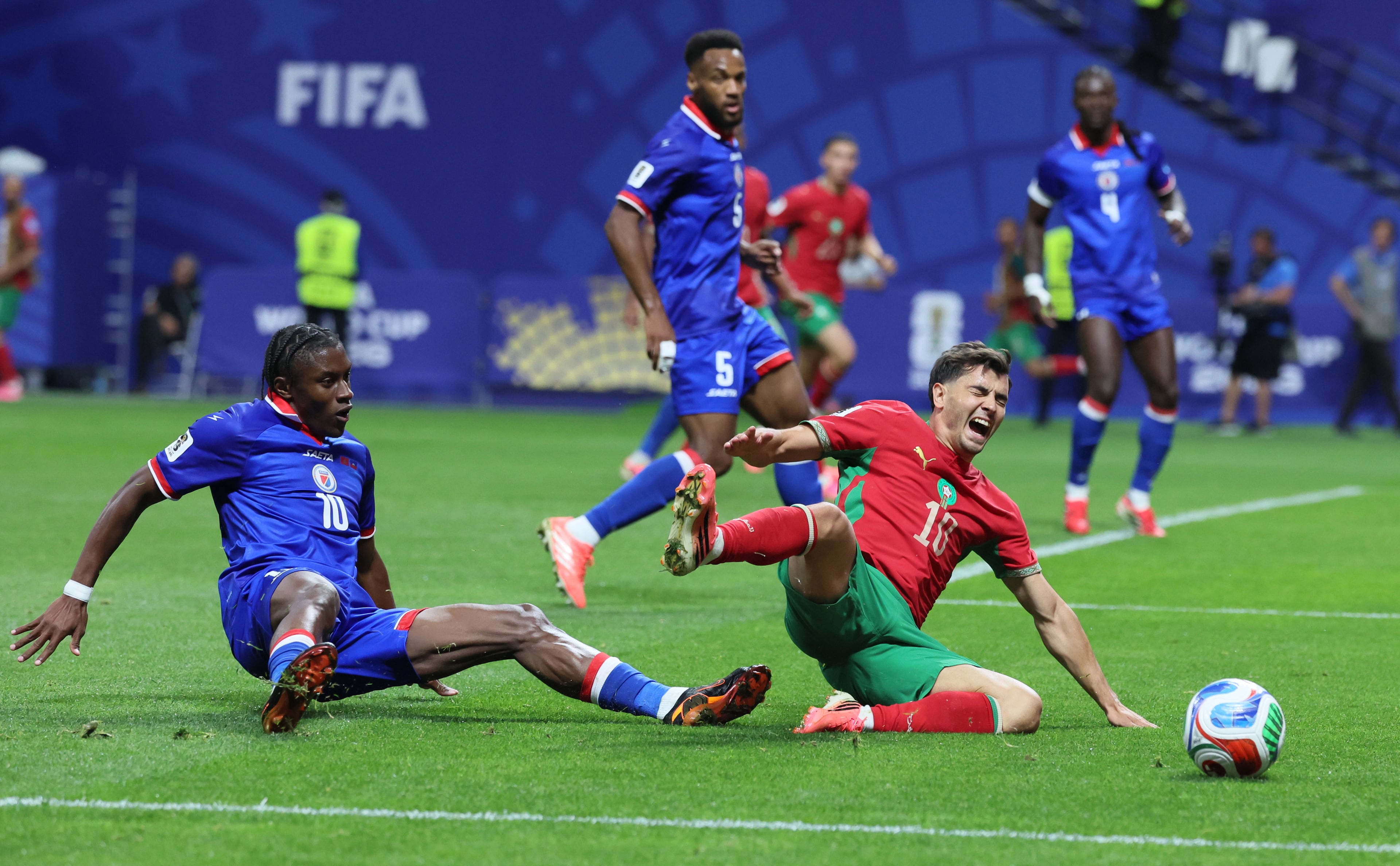 Morocco's Brahim Diaz, right, is tripped up by Haiti's Jean-Ricner Bellegarde during second half of Morocco vs. Haiti Group C FIFA World Cup match at Atlanta Stadium (Mercedes-Benz Stadium) on Wednesday, June 24, 2026. (Jason Getz/AJC)