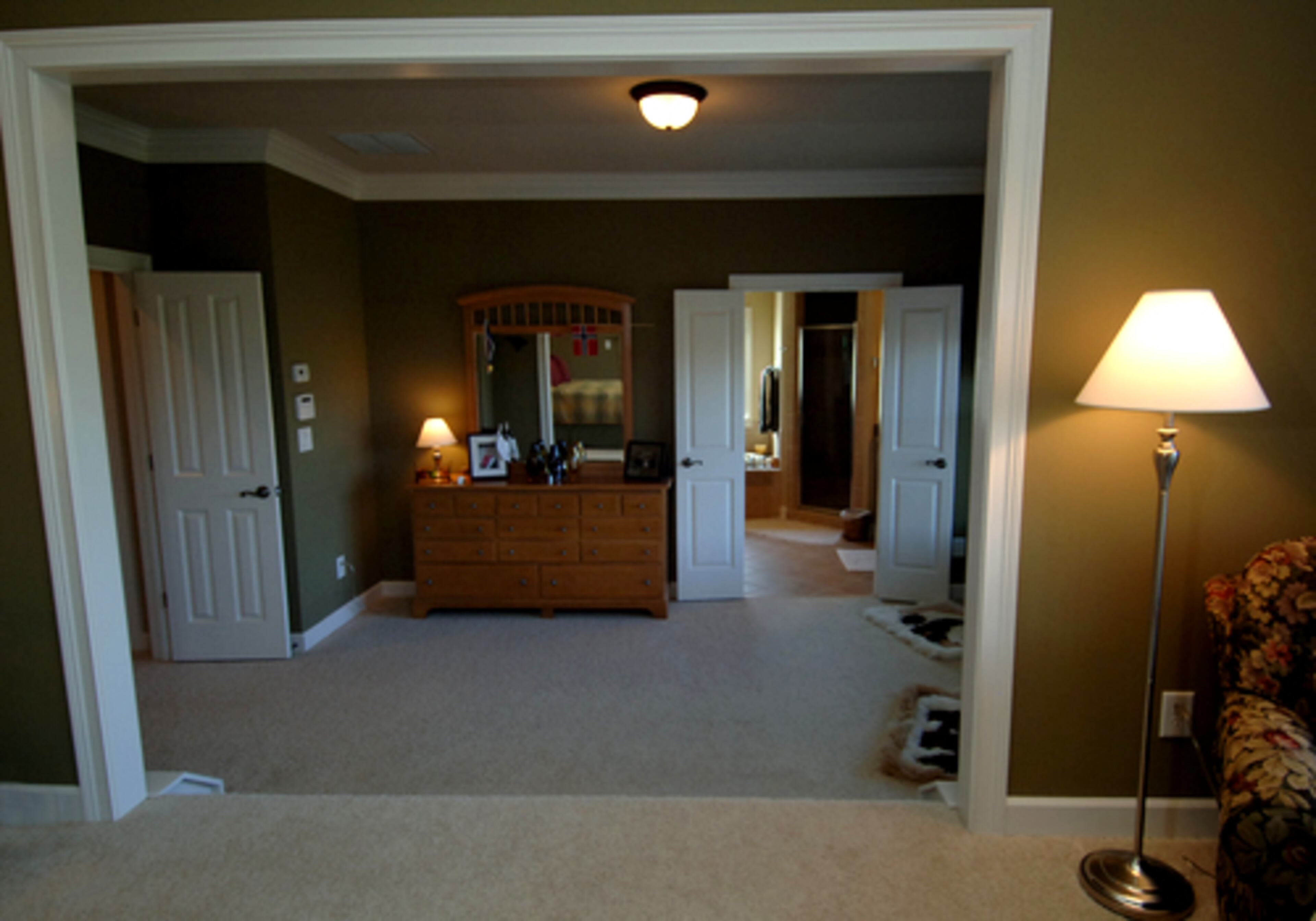 The master suite steps down to the closets and the master bath.