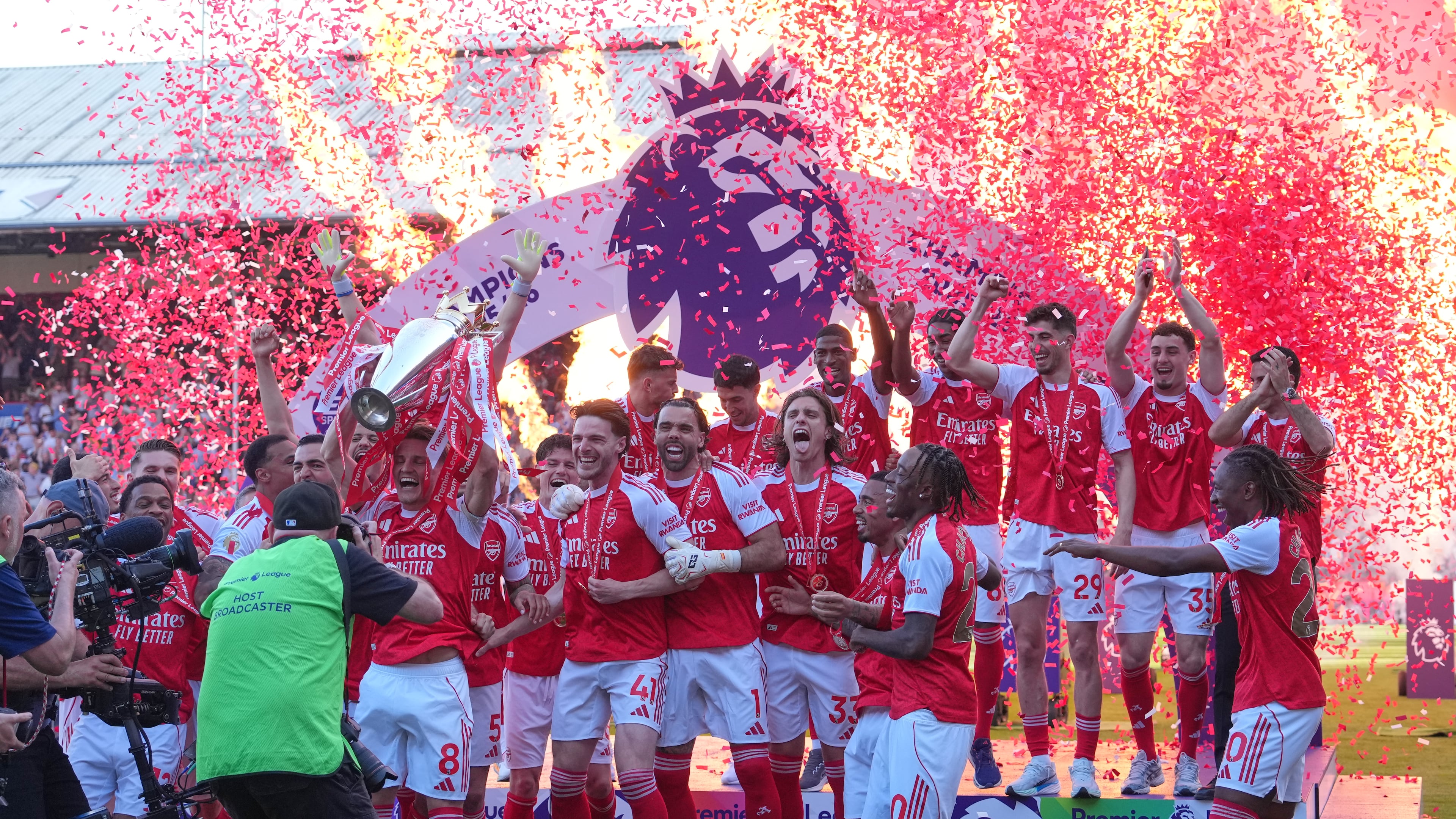 Arsenal players celebrate their Premier League title with the trophy after the English Premier League soccer match between Crystal Palace and Arsenal in London, England, Sunday, May 24, 2026. (AP Photo/Kin Cheung)